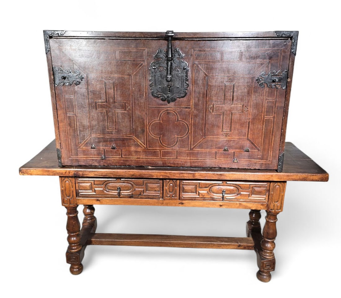 Bargueño called "El Escorial" 16th Century - Herrerian Style, Spain, 16th Century: An elegant 17th-century Spanish cabinet (vargueño), finely crafted from walnut and exotic woods. The drop-front reveals a richly decorated interior with lemonwood marquetry, numerous small drawers, a
