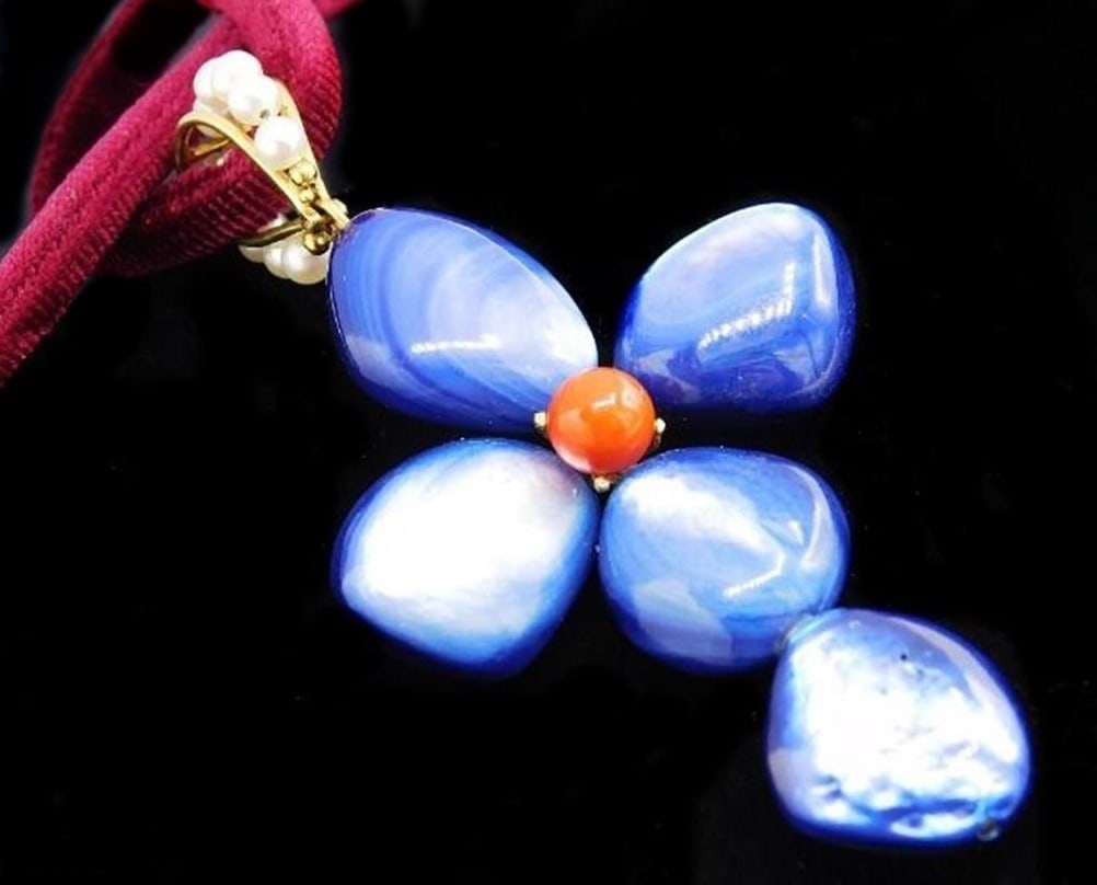 Cross pendant with coral and 18 karat gold: 18k yellow gold (750), natural blue mother-of-pearl, and natural red coral. Italian-designed cross pendant with an 8mm diameter spherical red coral center from Sardinia and a large bail adorned with f