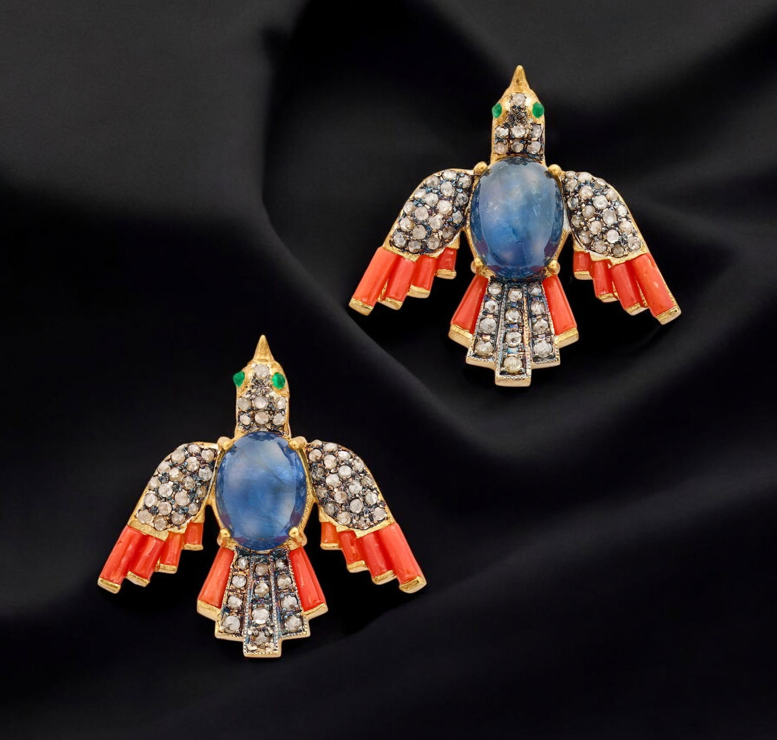 Pair of bird-shaped earrings with sapphires, coral and diamonds: A pair of silver earrings with a gilt finish, designed in a figurative bird motif and embellished with colored stones and rose-cut diamonds. The piece incorporates 112 rose-cut diamonds with a combine