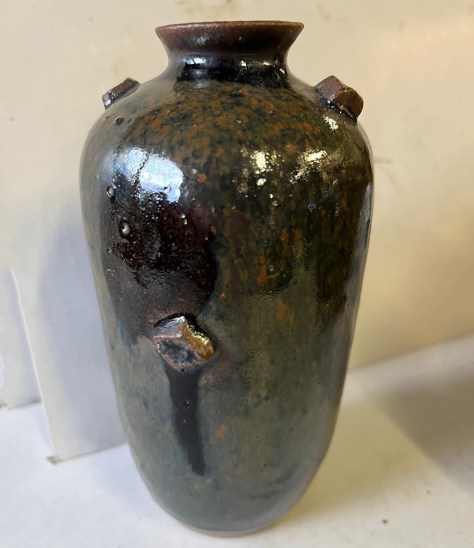 Small ovoid vase with a small flared neck in fine sandstone with a monochrome black glaze shaded (1 of 12)