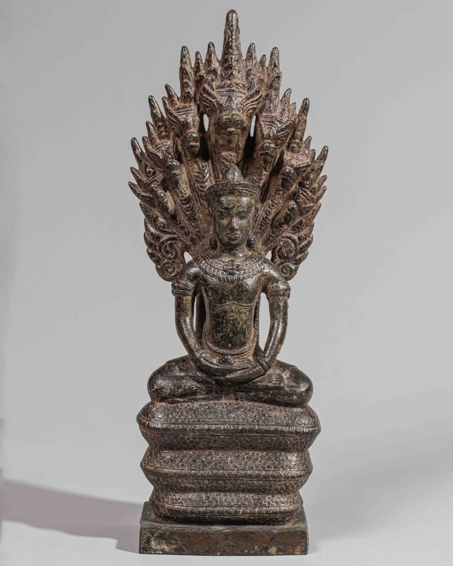 Buddha Mucilinda sitting on the seven-headed Naga, unfurling his hood to protect Buddha from the (1 of 8)