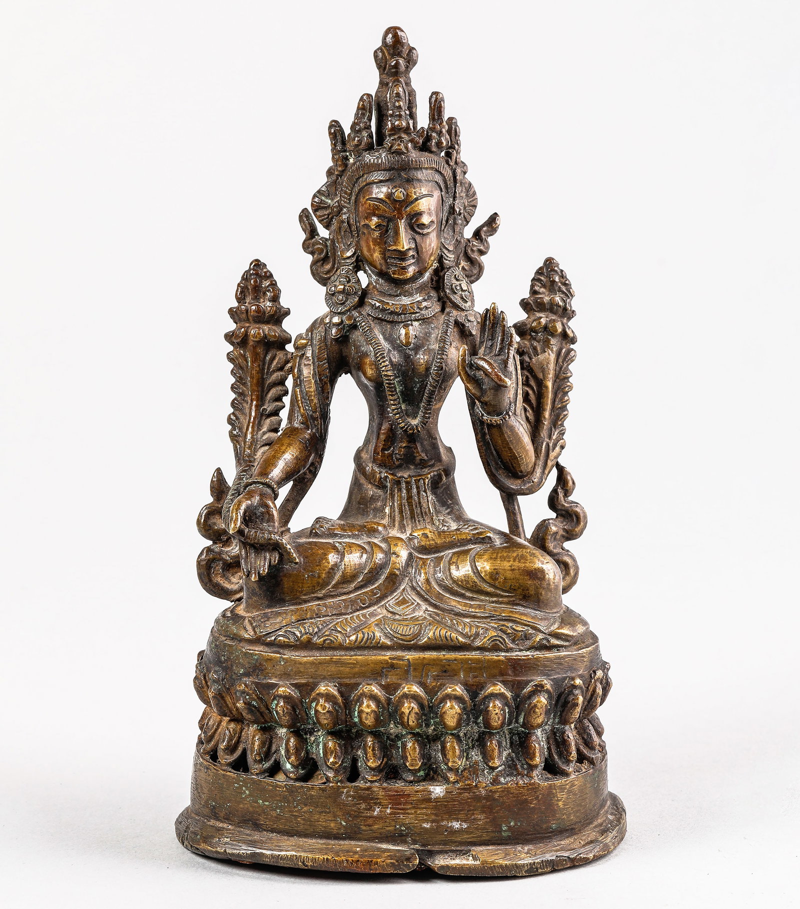 White Tara seated on a lotus-shaped base with a double row of jeweled petals, crowned with a diadem (1 of 6)