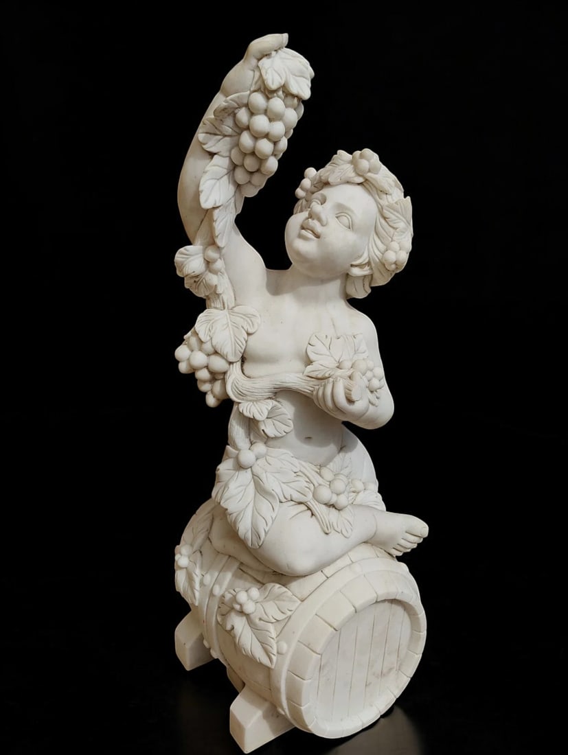 Carrara marble sculpture representing Bacchus, Italy, 20th century: Carrara marble carved from a single block. Dimensions: 100 × 40 × 40 cm. An imposing sculpture of exceptional craftsmanship, with meticulous anatomy and detailed execution. Generous in size and cons