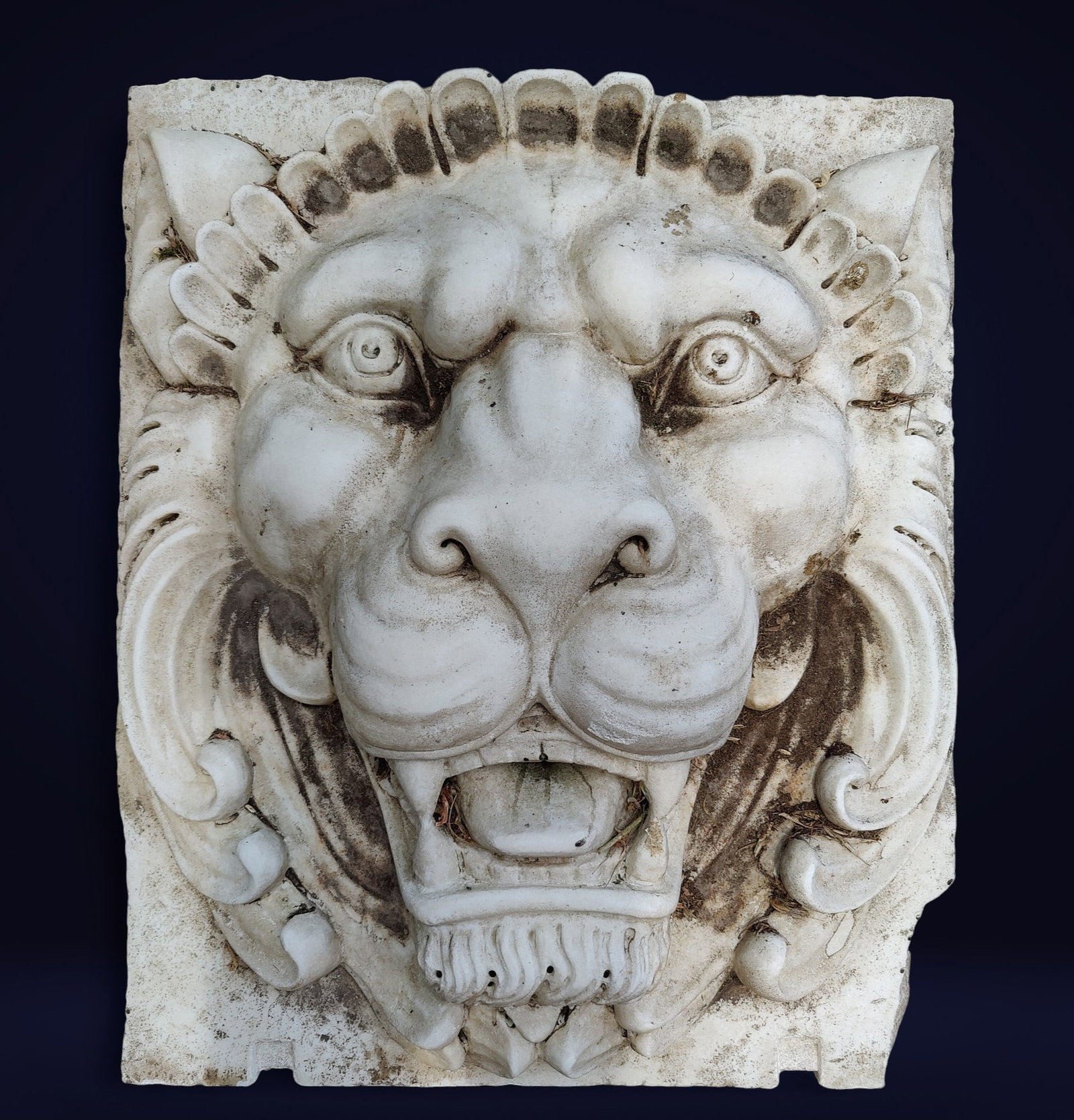 Large lion figurehead in Carrara marble, Italy, 19th century: Measurements: 77 x 91 x 15 cm. Carved Carrara marble. Depicting a large lion figurehead with a beautiful patina. Located in an international warehouse.