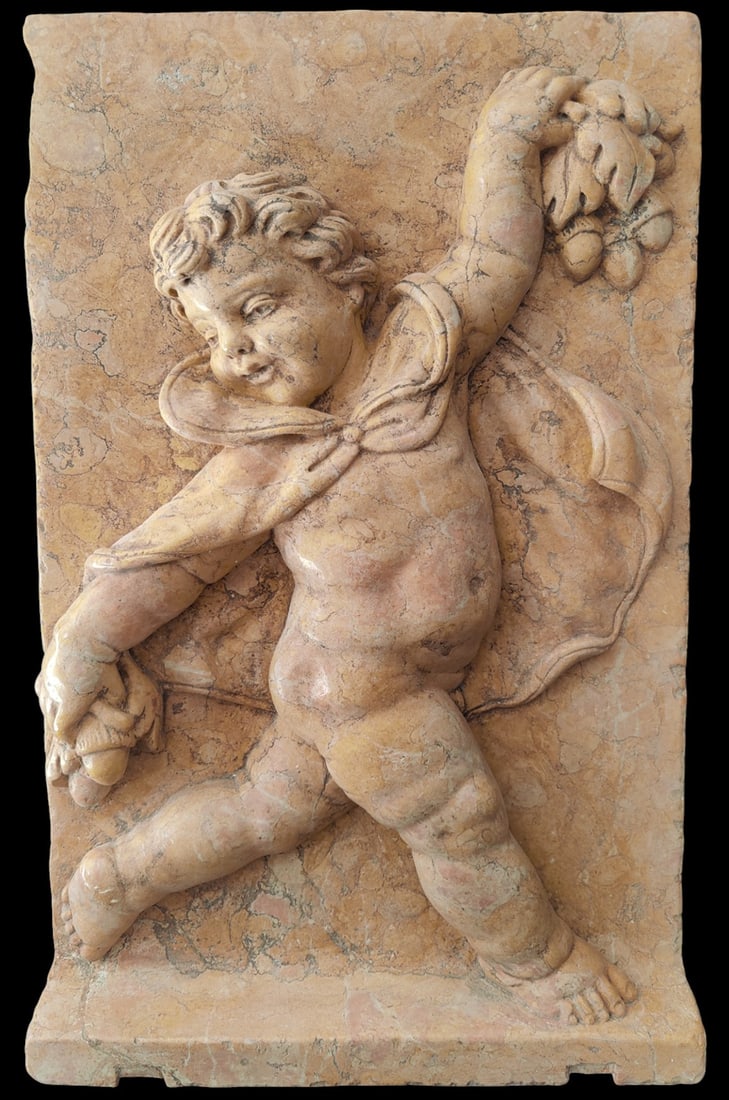 Yellow carved marble panel with an allegorical putto of winter, Italy, 19th century: Representation of a putto symbolizing the winter season, made of genuine yellow marble. Dimensions: 61 x 37 cm. Weight: 20 kg. Located in an international warehouse.