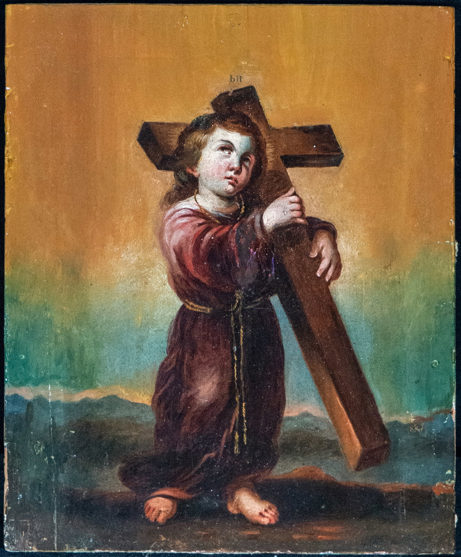 Infant Jesus with the cross. Sevillian school. 17th century: Oil on panel. Measures 24 x 19 cm. A small devotional painting depicting the Christ Child walking barefoot while embracing a large cross, in a scene of profound symbolic meaning that foreshadows the P