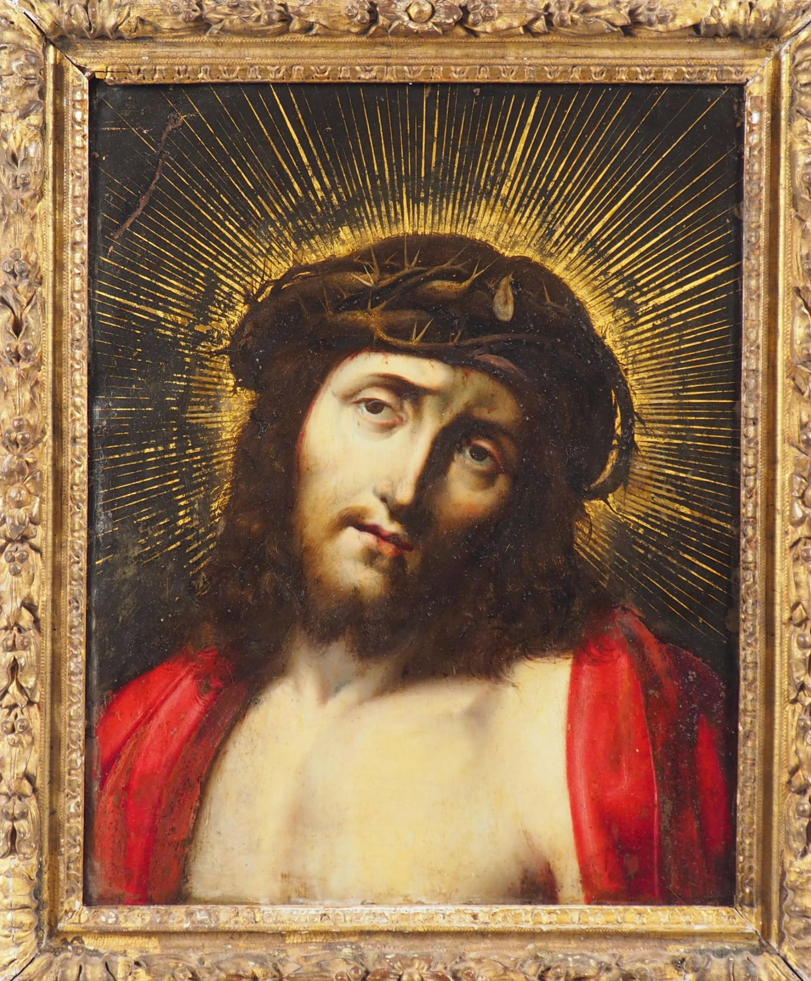 Ecce Homo. Flemish master from Antwerp to be identified. 17th century: Oil on copper. This work depicts Christ crowned with thorns, his head slightly bowed, his gaze serene, filled with restrained pain. The halo of golden rays radiating from his head reinforces his divin