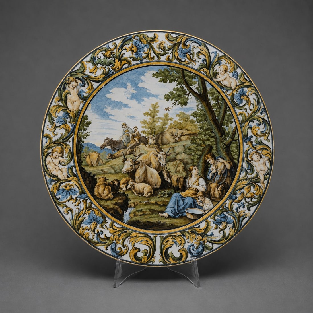 Castelli compendium plate with bucolic scene, Carlo Antonio Grue, Italy, 17th century: Polychrome majolica. Dimensions: 48 cm in diameter. An important compendium plate made by Carlo Antonio Grue, belonging to the renowned Castelli dynasty of ceramists who brought Italian Baroque majoli