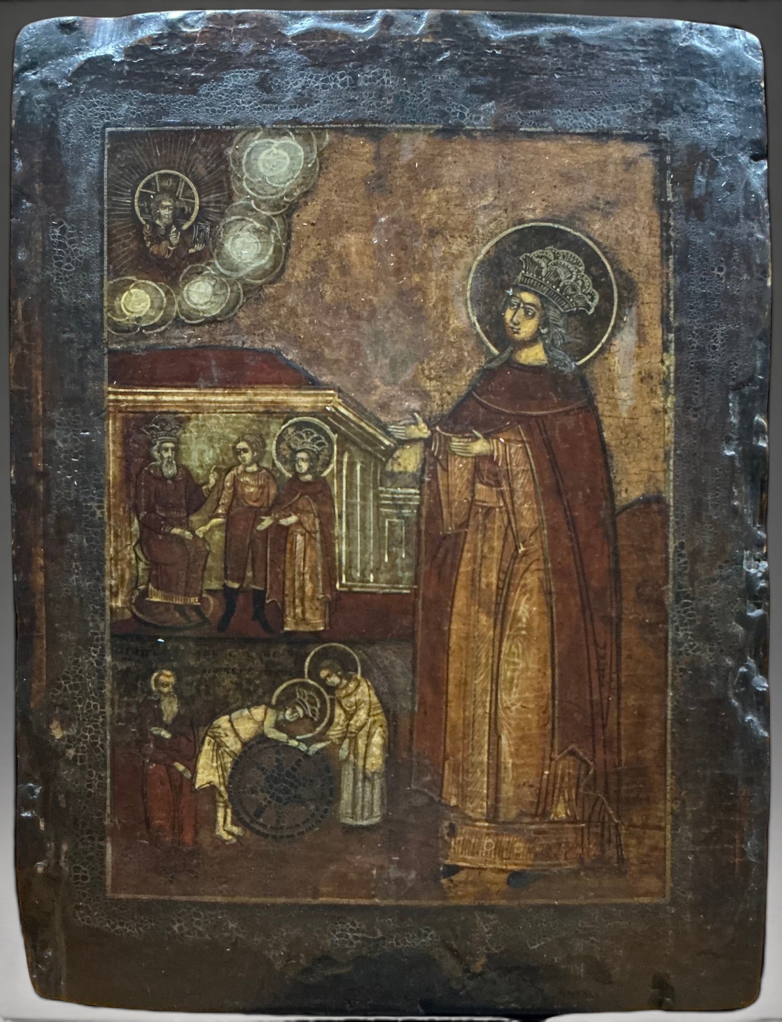 Antique Icon of Saint Catherine of Alexandria, Russian School, 17th-18th Century: Tempera on wooden panel. Measures 31.5 x 24 cm. Icon depicting Saint Catherine of Alexandria standing and crowned, dressed in a tunic and mantle in reddish and ochre tones. In the upper left, Christ a
