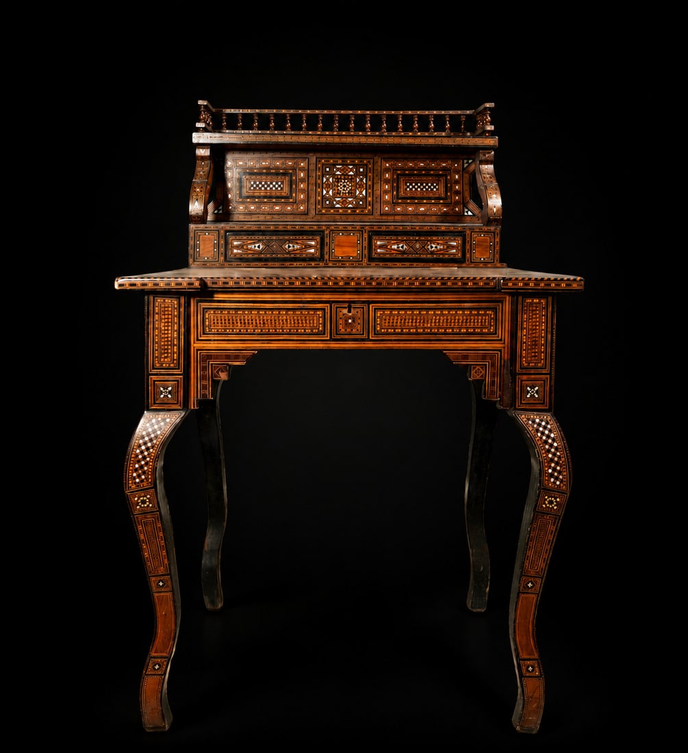 Beautiful Moorish Desk in Nasrid Style, Granada, late 19th century: Made of wood, profusely decorated with bone inlay, mother-of-pearl, and marquetry. 111 x 70 x 60 cm. Provenance: private collection, Barcelona.