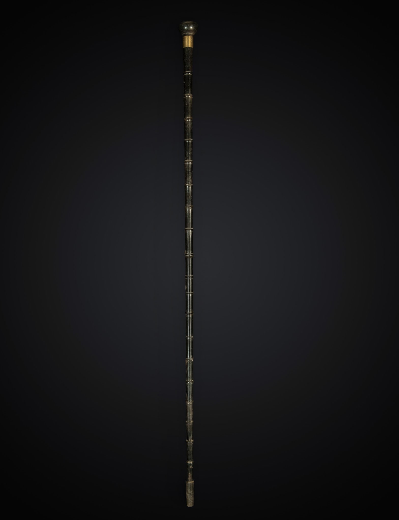 Important bamboo pole, colonial Caribbean, 19th century: Black coral, metal soul.