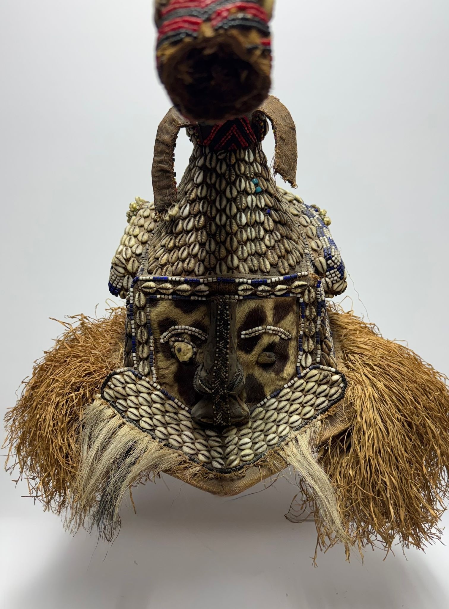Mukenga helmet-mask. Kuba Congo: Congo - Wood, raffia, cowrie shells, glass beads, animal skin. 20th century. 50 × 30 cm