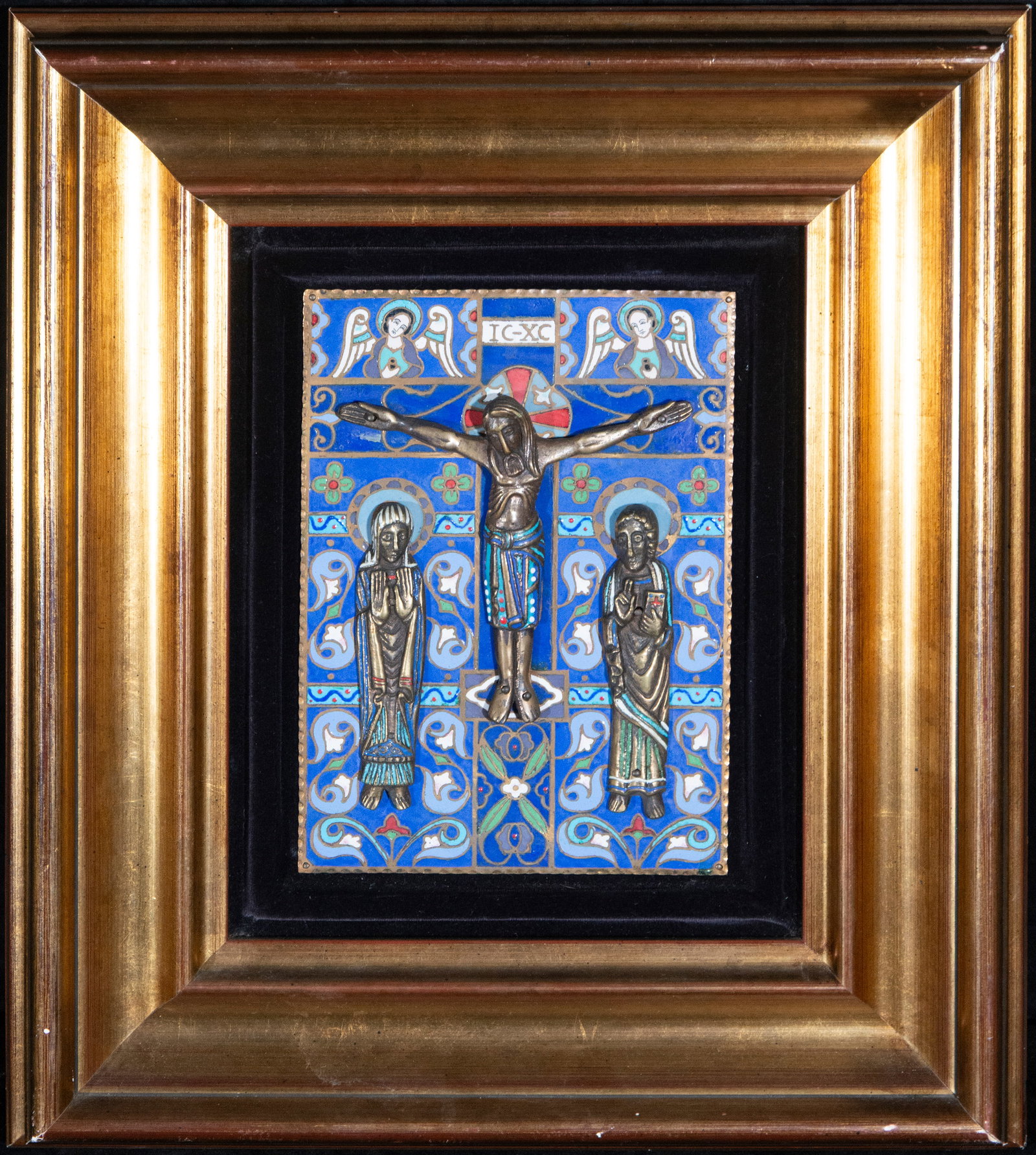 Limoges-type enamel attributed to Morato, Barcelona, ??1940s-1950s: Cloisonné enamel and applied metal, framed. Dimensions: 22 cm x 17 cm; 45 cm x 37 cm. Devotional plaque depicting the Calvary scene on a blue enameled background, decorated with floral motifs, angels