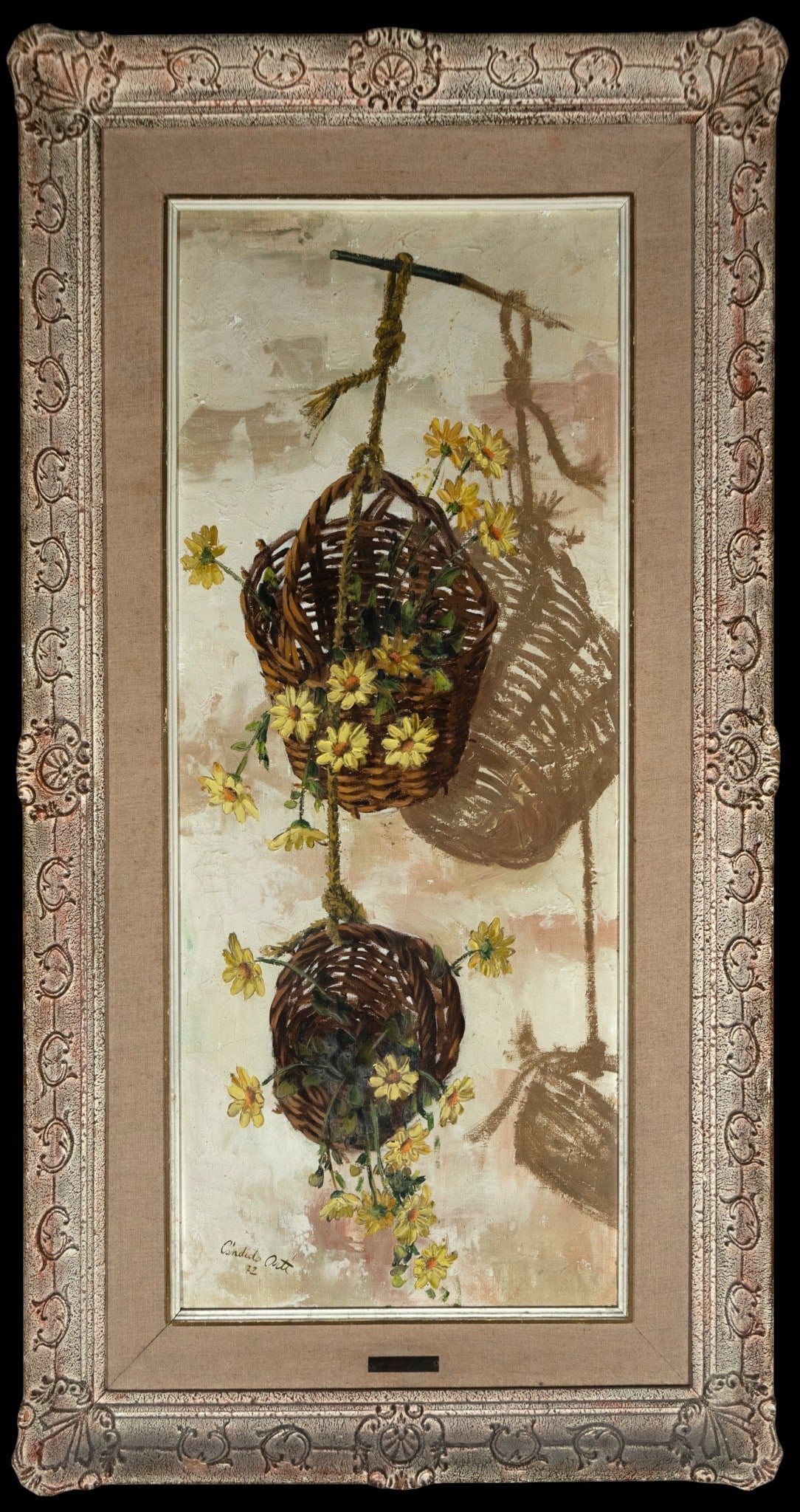 Baskets with yellow flowers, Signed, Spanish School, 20th Century: Oil on canvas. Vertical composition with two suspended wicker baskets adorned with slender yellow flowers, set against a light background of beige and pink tones. The cast shadows add depth and dynami