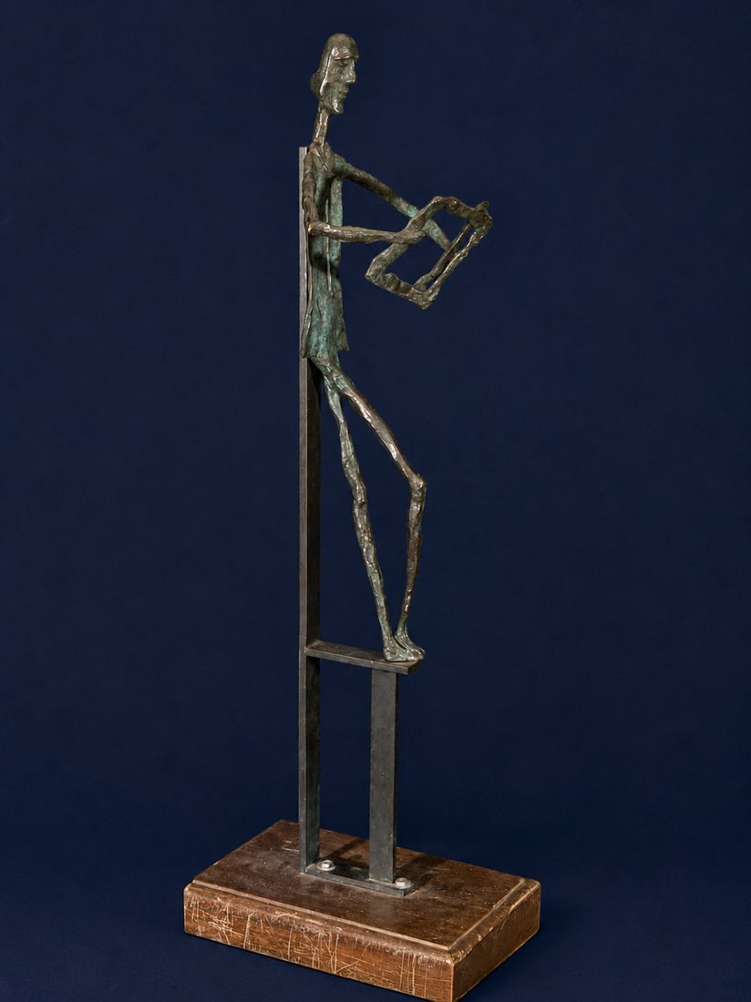 Expressionist bronze sculpture, Contemporary School, 20th Century: Patinated bronze on a marble base and metal structure. A stylized male figure, conceived in an expressionist style with elongated lines and schematic anatomy, holds a geometric frame in its hands. The