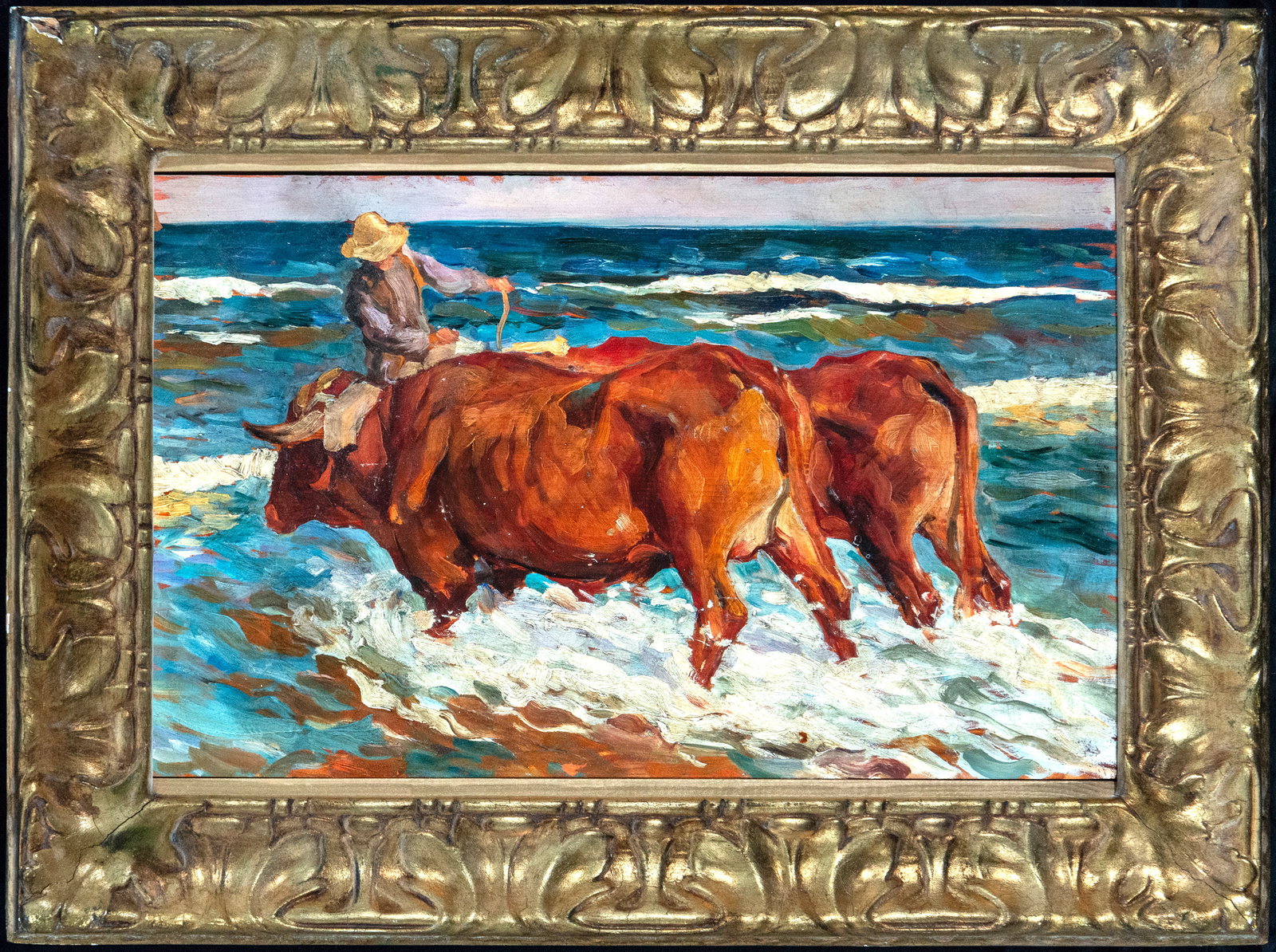 Oxen in the Sea, follower of Sorolla - 20th Century: Oil on panel. Marine scene featuring a team of oxen moving through the water alongside a peasant figure partially covered by a hat and cloths billowing in the wind. The composition is notable for the 
