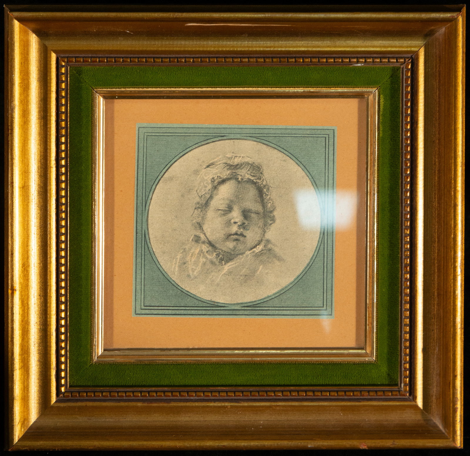 Drawing of a girl, Spanish School, 19th Century: Graphite on paper. Dimensions: 11 x 11 cm; framed 28 x 26 cm. A child's portrait inscribed in a circular format, depicting the face of a sleeping or reposeful girl, captured with great delicacy and ps