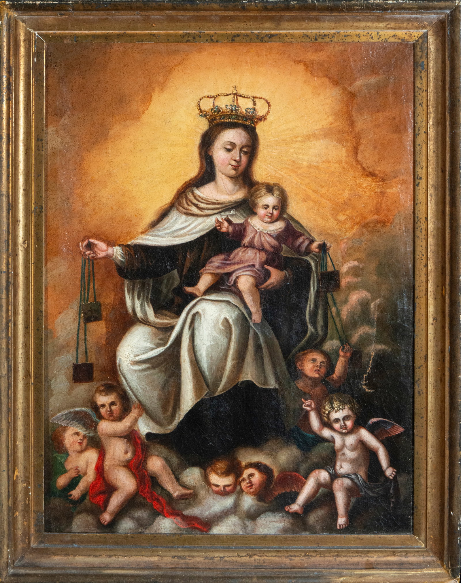 Our Lady of Mount Carmel with Child and Souls in Purgatory, Spanish School, 18th Century: Oil on canvas. Devotional image of Our Lady of Mount Carmel enthroned on clouds, holding the Christ Child, while extending scapulars as a symbol of protection and spiritual salvation. The Virgin appea