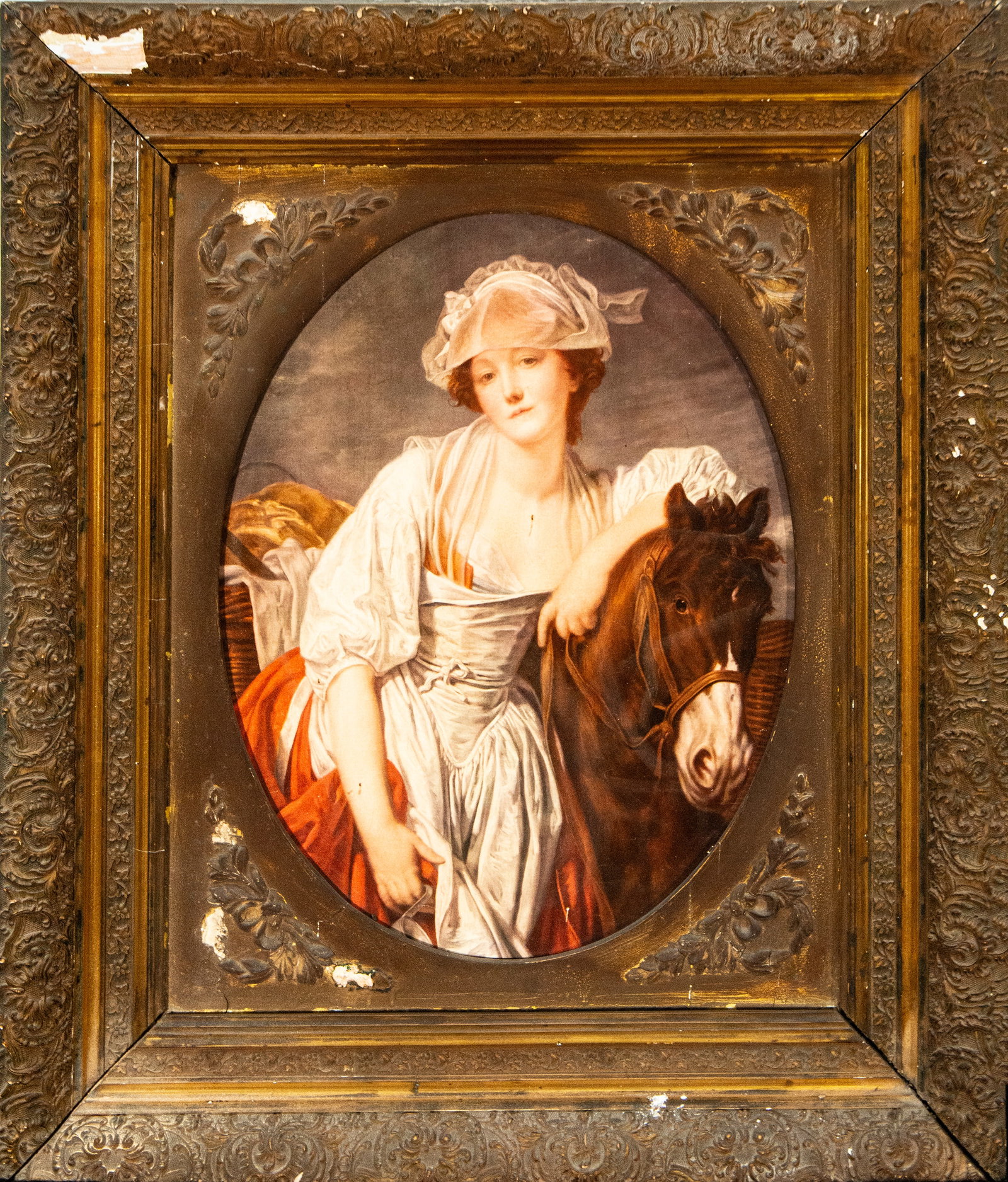 Frame with female print, European School, 19th Century: Framed print with a gilt frame. Dimensions: 54 x 41 cm; 81 x 69 cm. 19th-century frame with rich perimeter decoration of scrolls, flowers, and plant motifs, accompanied by an oval print depicting a wo