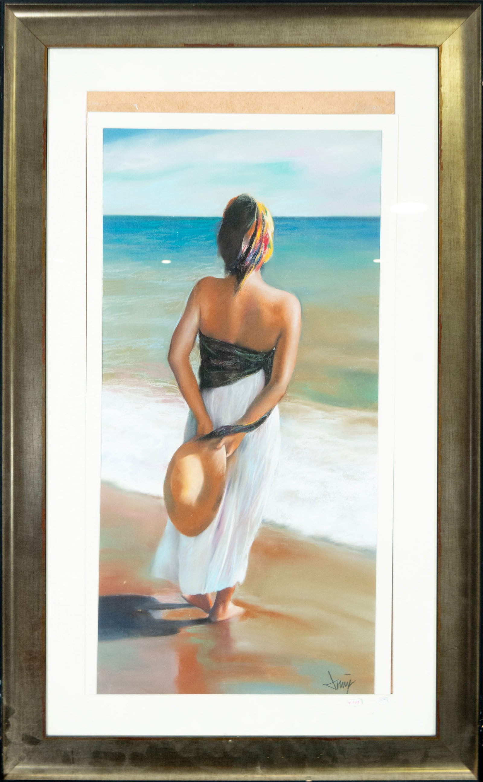 Woman Facing the Sea. Signed Domingo ?lvarez Gómez, Spanish School, 21st Century: Pastel on paper. Dimensions: 75 x 37 cm; 105 x 65 cm. Vertical composition featuring a female figure gazing at the sea horizon with her back to the viewer, holding a wide-brimmed hat by the shore. The