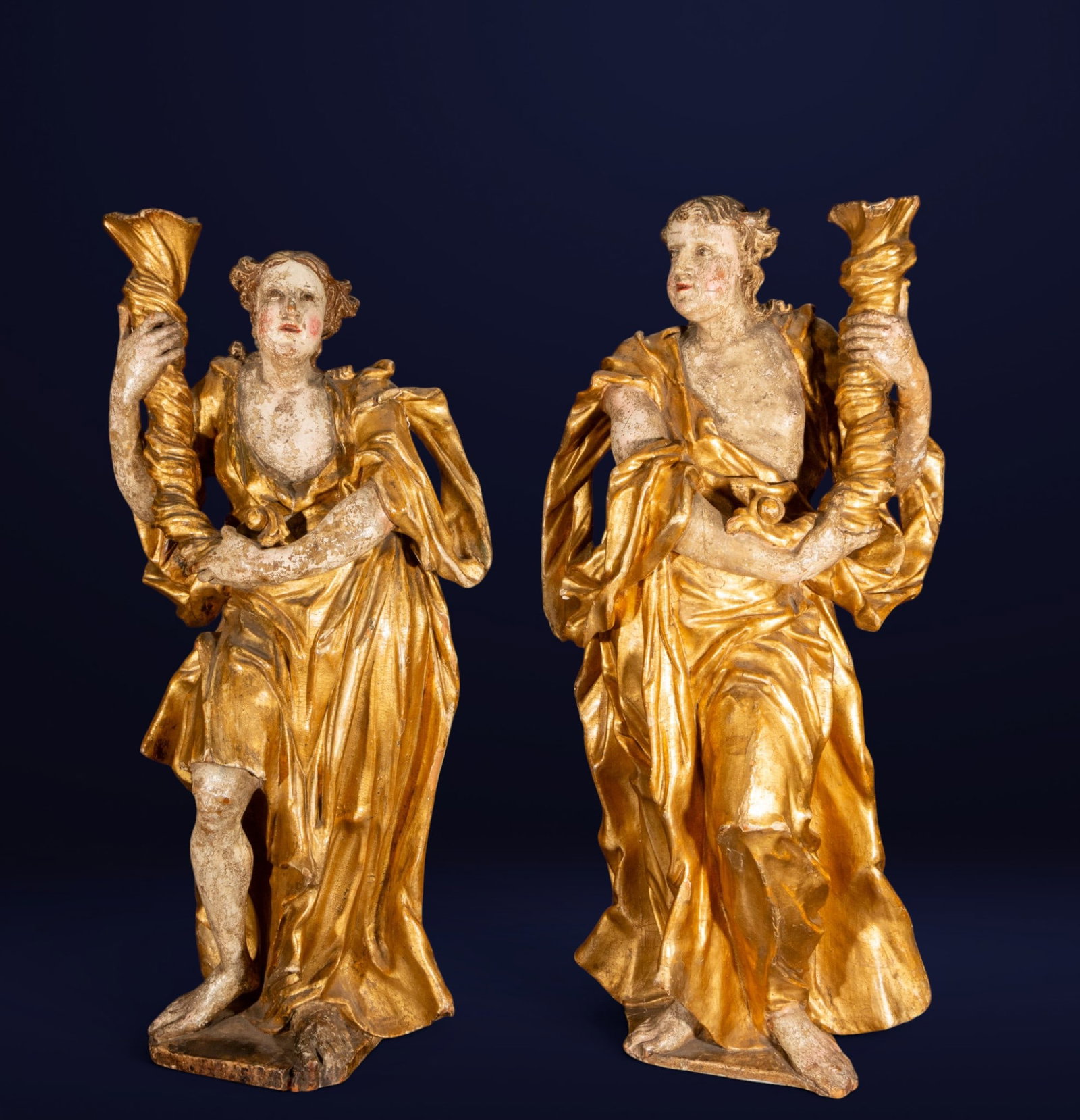 Decorative and Massive Pair of 16th Century Torch Holders - Southern Germany or Italy: Carved, polychrome, and gilded wood. Dimensions: 114 x 54 x 31 cm; 120 x 53 x 30 cm. Provenance: important private collection.
