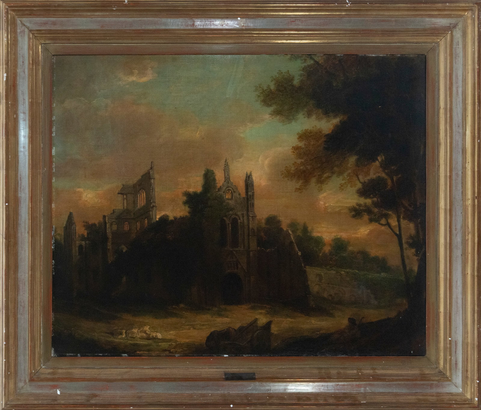 Gothic ruins at sunset. British School. 19th century.: Oil on canvas. Dimensions: 91 x 69 cm (unframed), 112 x 90 cm (framed). The painting depicts a romantic view of Gothic ruins in a twilight landscape, dominated by a warm-toned sky that contrasts with 
