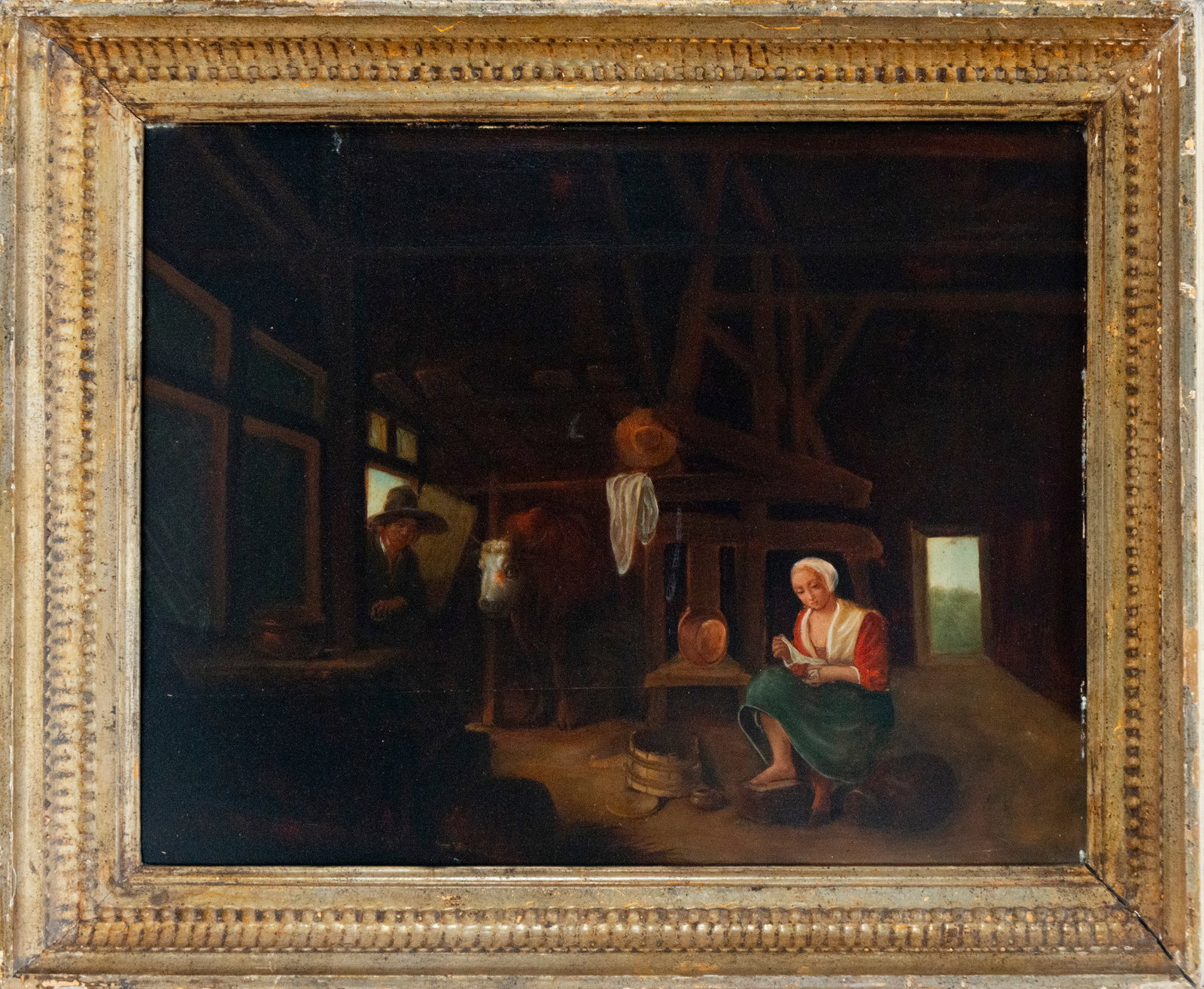Interior of a stable with a peasant woman spinning. Flemish school. 19th century.: Oil on canvas. Dimensions: 53 x 39 cm unframed, 61 x 53 cm framed. The scene depicts the somber interior of a rural stable, where a peasant woman, dressed in a white cap, red blouse, and green skirt, 