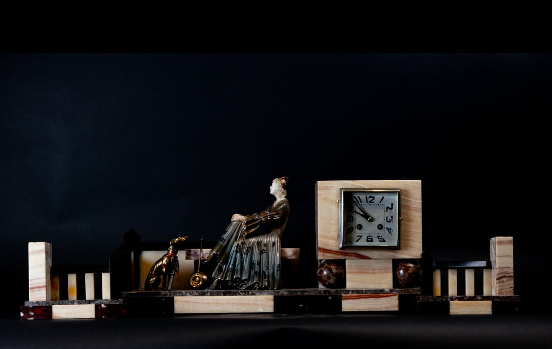 Important Art Deco Trim in Onyx and Marble representing a Lady with a Greyhound, French school from: Clock measures: 24 x 58 x 14, candlestick measures: 13 x 18 x 7 cm