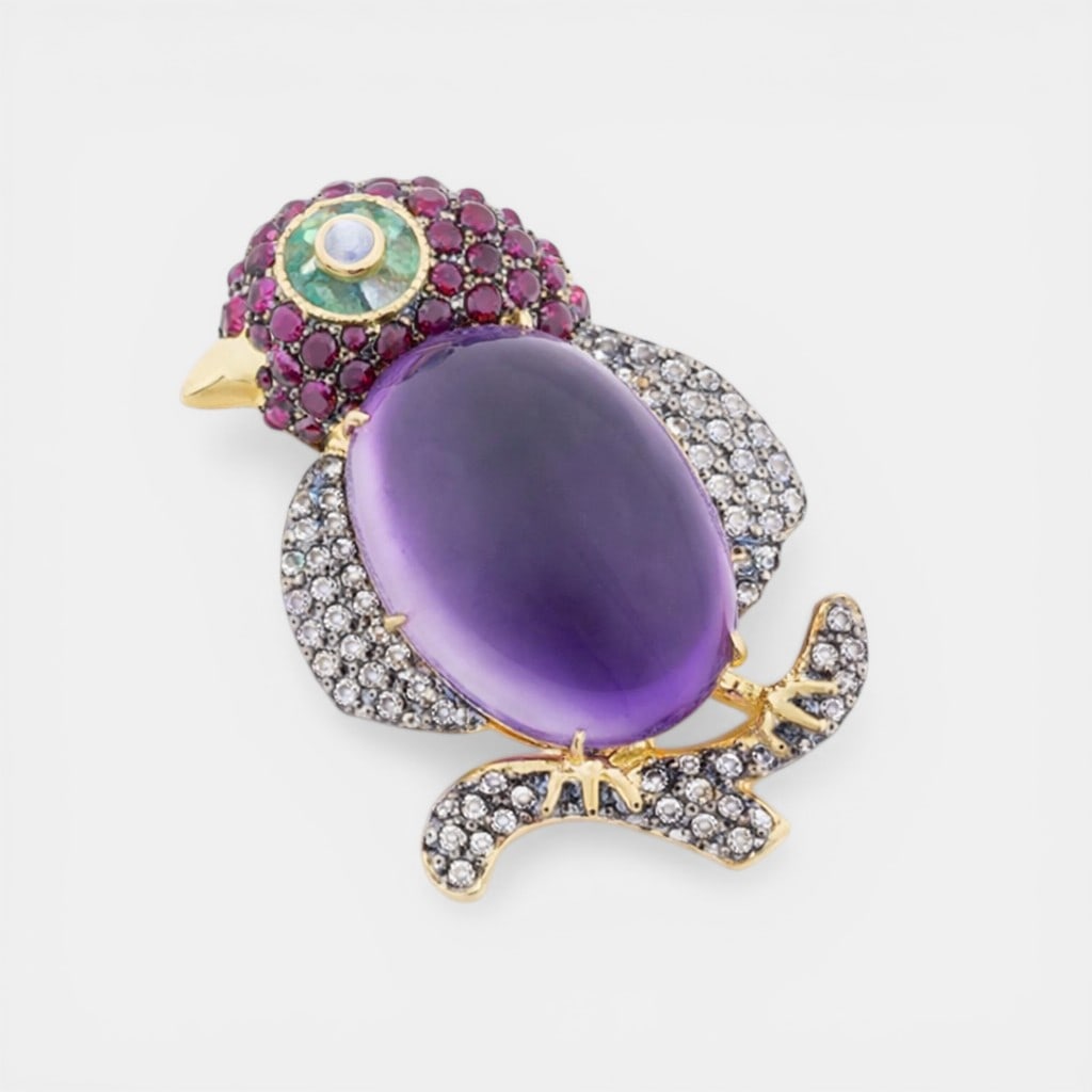 Brooch/pendant with amethyst of approx. 25 ct, rubies of approx. 1.50 ct, emeralds of approx. 0.40: Rose-cut diamonds, approx. 0.75 ct; amethyst, approx. 25 ct; moonstone, approx. 0.15 ct; rubies, approx. 1.50 ct; emeralds, approx. 0.40 ct; .925 sterling silver and gold-plated silver; 14K gold bail 