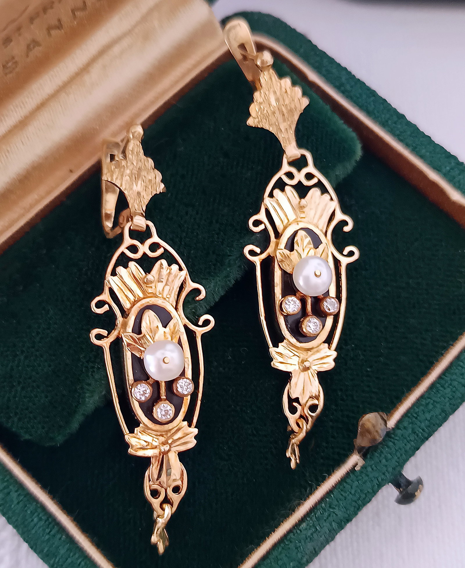 Victorian 18K gold earrings with diamonds, seed pearls and onyx, 19th century, weight 6.55 g.: Pair of antique Catalan Victorian-era earrings, featuring three moving parts, crafted in 18-karat bright yellow gold with chased and polished details. They are set with six old-cut diamonds and two na