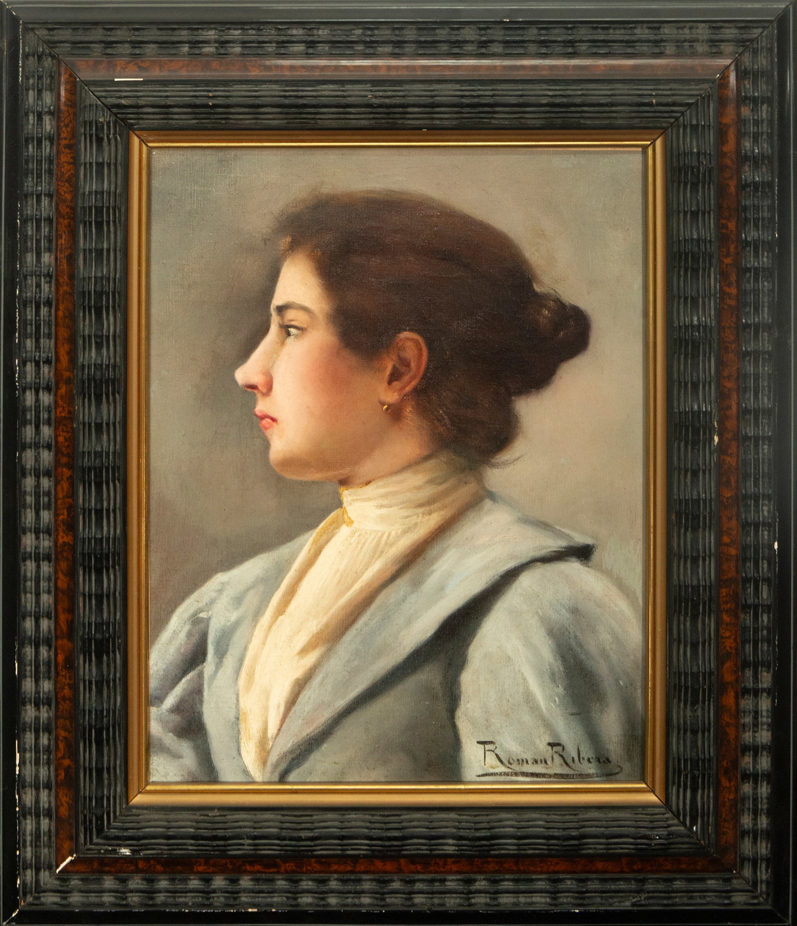 Bust portrait of a lady. Signed Román Ribera y Cirera. Spanish School. 19th century.: Oil on canvas. Measures 38 x 29 cm. Profile portrait of a woman, in which the model wears an updo and a light blouse against a neutral background. The simplicity of the composition focuses attention o