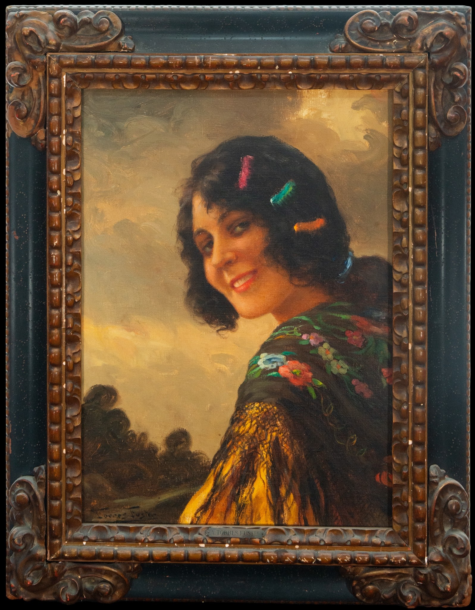 Portrait of a lady with a shawl. Antonio Torres Fuster. Signed. Catalan School. 19th-20th century.: Oil on canvas. Dimensions 55 x 41 cm. Portrait of a smiling woman, wrapped in a yellow shawl embroidered with flowers, against an open sky. The energetic brushstrokes and warm tones of the sunset lend