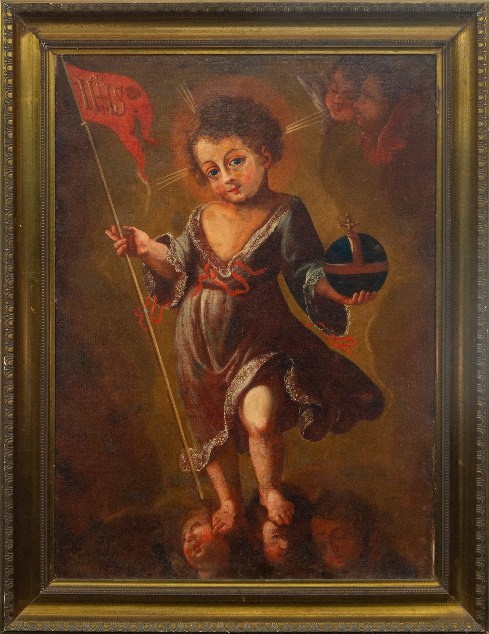 Boy with the Ball. Portuguese School of Josefa de Óbidos. 17th Century: Oil on canvas. Dimensions 86 x 60 cm. Image of the Divine Child holding the orb and the banner of Redemption. The figure rests on cherub heads and is surrounded by a golden atmosphere. This motif, wid