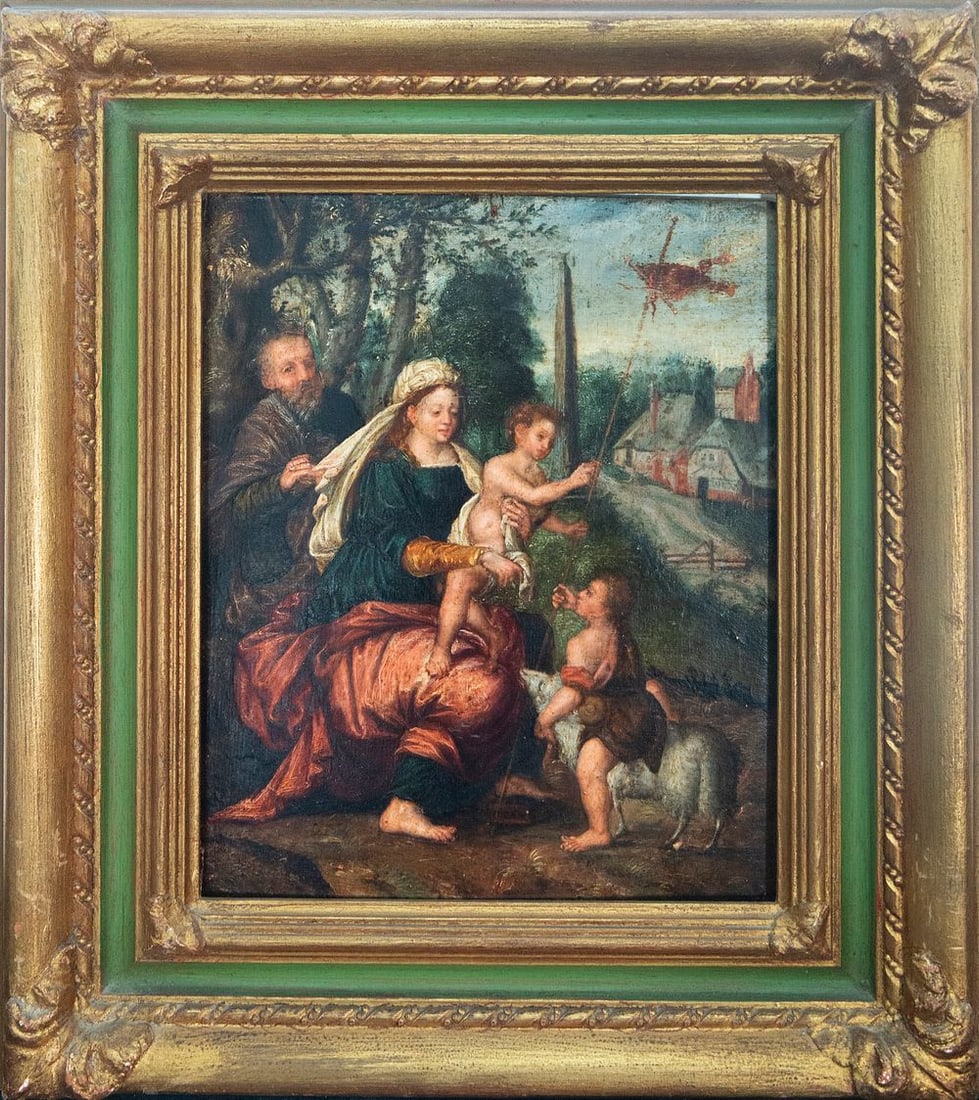 The Flight into Egypt. Style of Jos Van Cleeve, Flemish School. 17th Century.: Oil on panel. Measures 34 x 26 cm. Religious scene in which the Virgin Mary, seated with the Child in her arms and accompanied by Saint Joseph, rests in a wooded landscape while the infant Saint John 