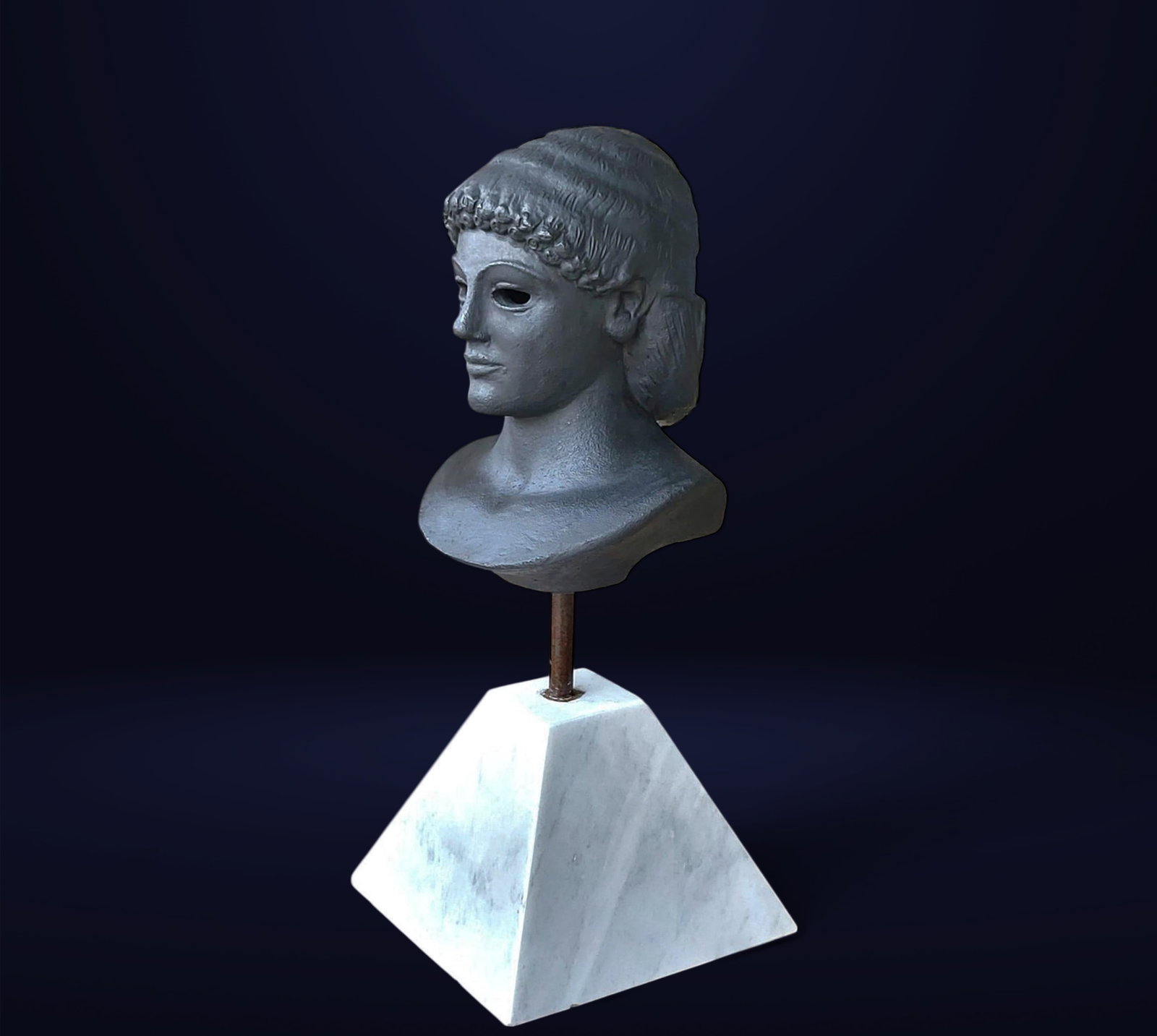 Terracotta bust of Apollo from Piombino, France, 19th century: Polychrome terracotta. Measurements: 46 x 15 x 20 cm.