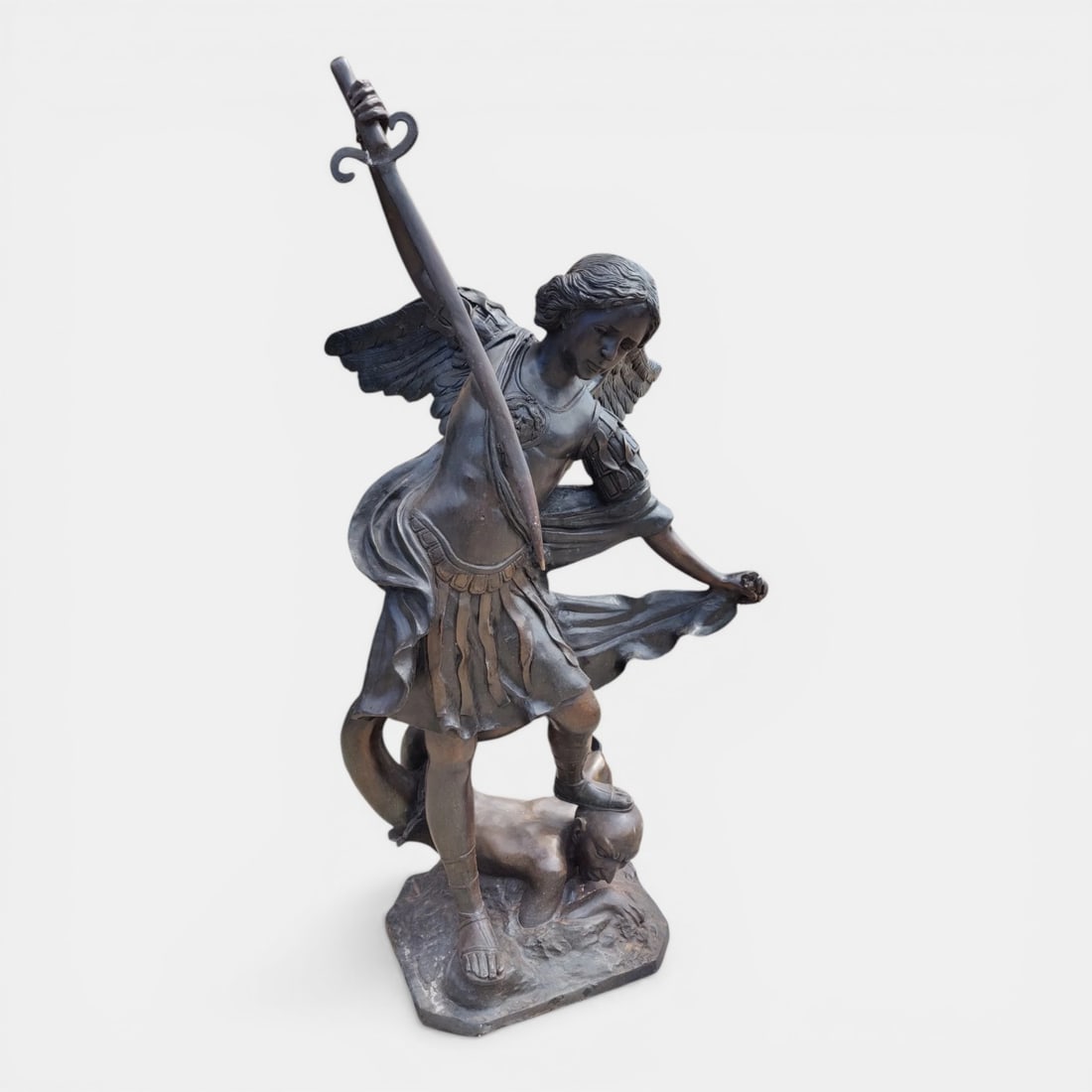 Saint Michael the Archangel defeating Lucifer, Italy, probably 20th century: Lost-wax cast bronze. Dimensions: 148 x 72 x 80 cm; base: 50 x 37 cm. Monumental bronze sculpture depicting Saint Michael the Archangel at the moment of slaying Lucifer, a powerful allegorical image o