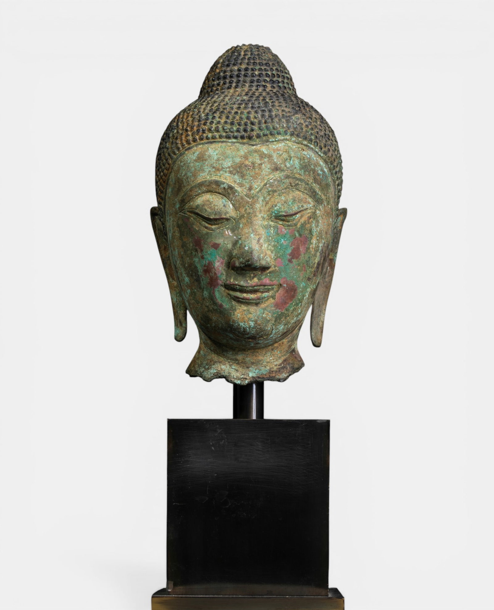 Buddha head with serene expression and ushnisha (1 of 3)