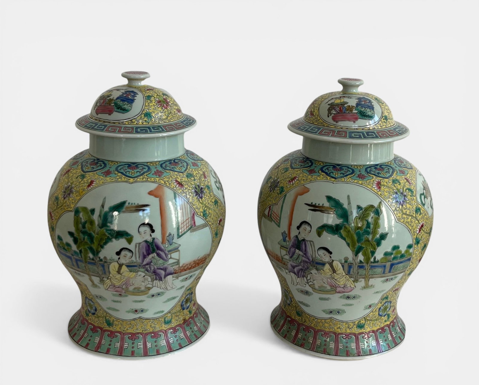 Pair of covered porcelain pots, pink family with family scenes: Decorated with polychrome enamels on one side, depicting a mother, her child, and their nurse during bathing, and on the other side, a child playing with a toad. The set is completed with other offeri
