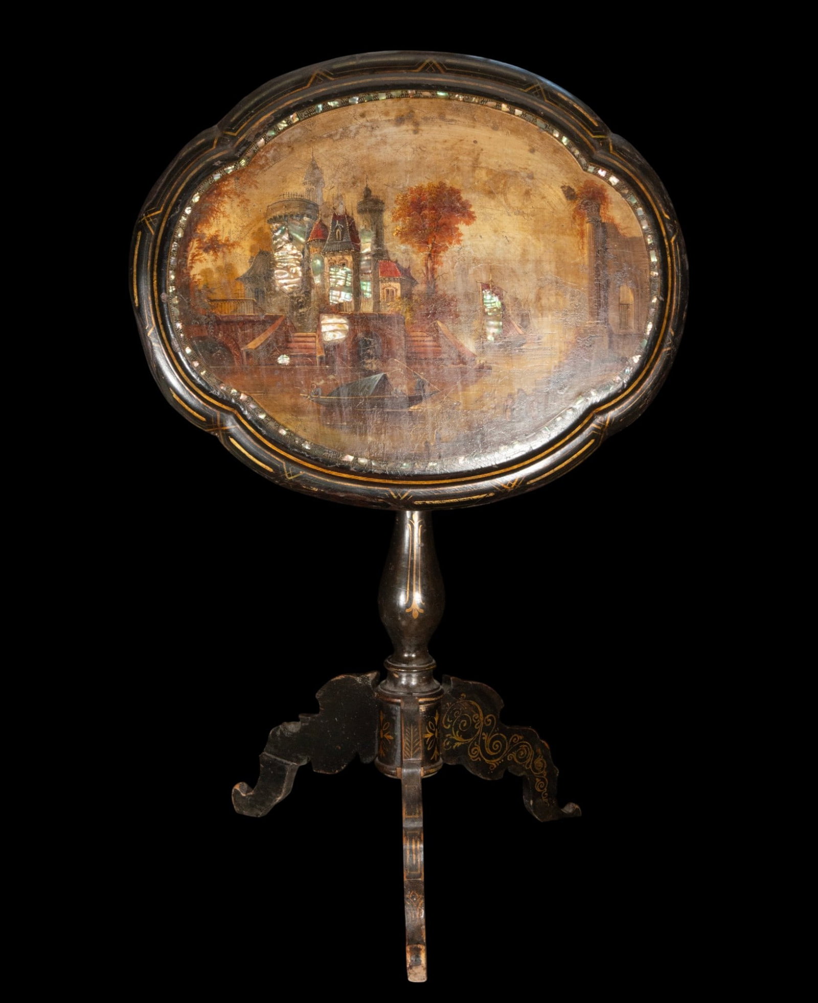 Philippine table in mother-of-pearl, 19th century: Wood and mother-of-pearl inlays. Measures 68 x 65 x 52 cm. Side table with a lobed top supported by a central column and truncated legs, decorated with fine gold lines and iridescent appliqués. The t