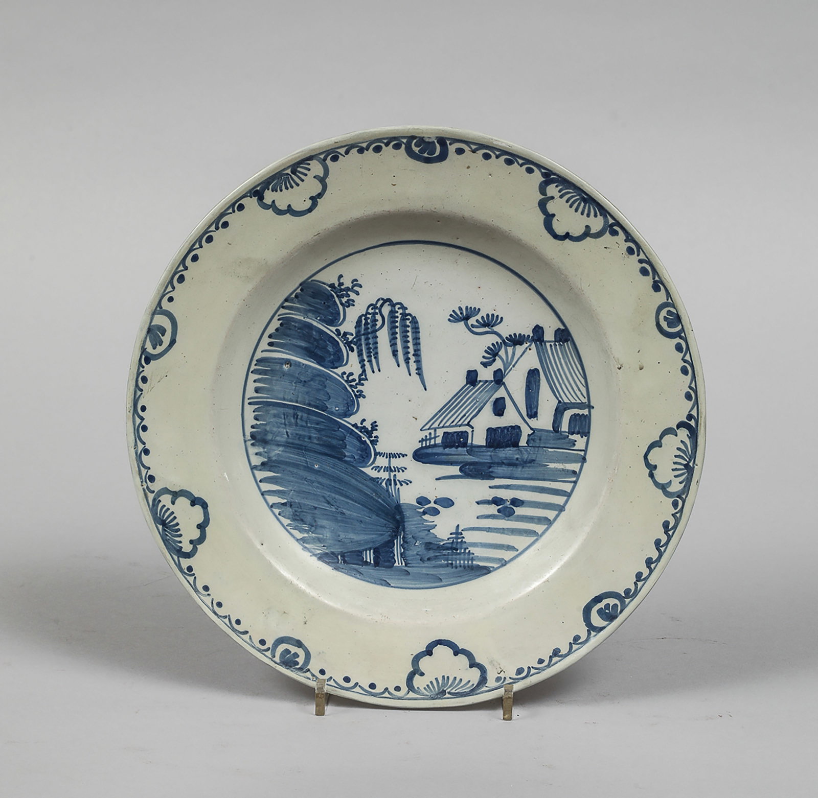 European earthenware plate with blue underglaze decoration (1 of 2)