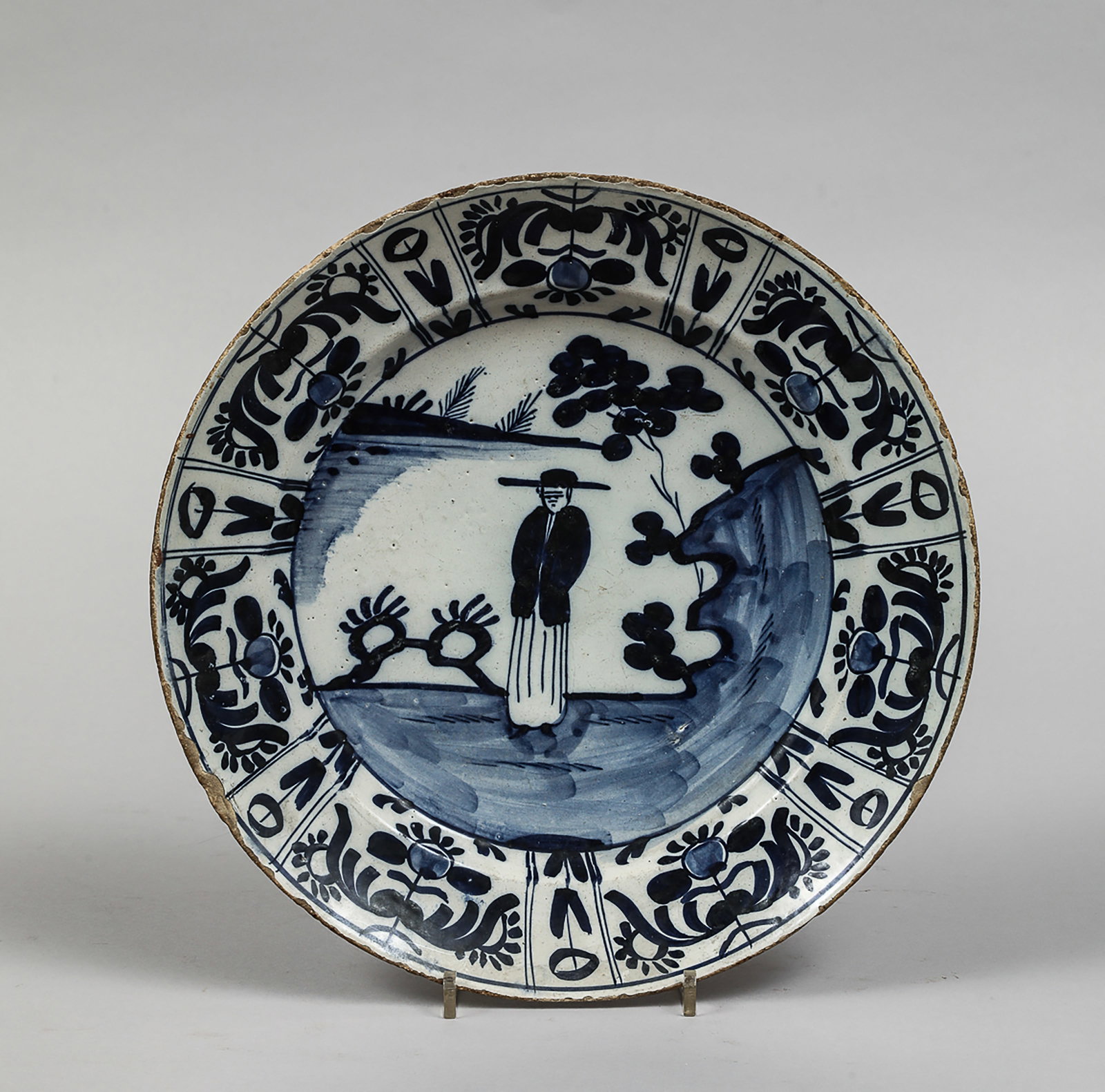 Earthenware plate with blue underglaze decoration (1 of 2)