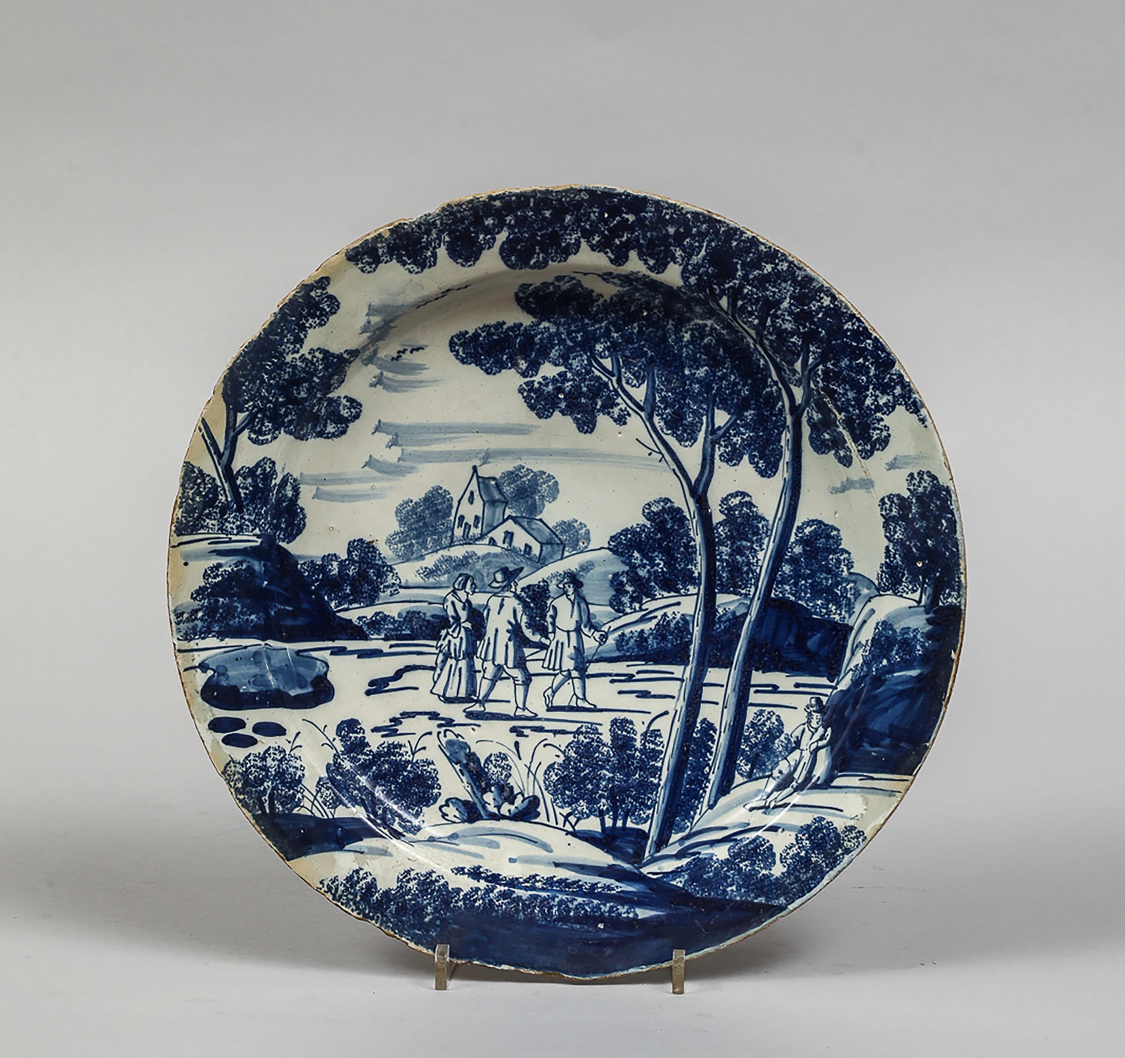 European earthenware plate with blue underglaze decoration and landscape scene (1 of 3)
