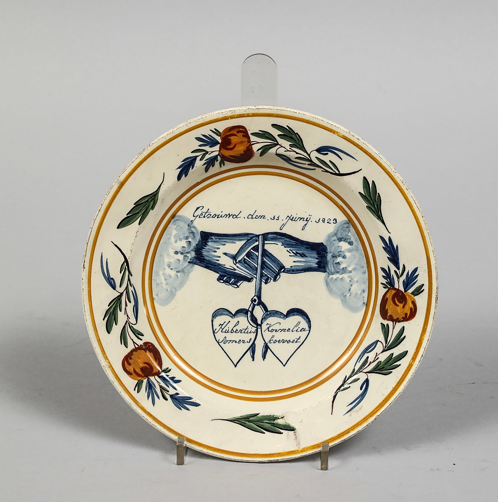 Polychrome earthenware plate with intertwined hands and inscribed hearts (1 of 2)