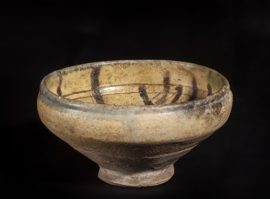 Deep ceramic bowl with beige glaze and brown decoration (1 of 2)