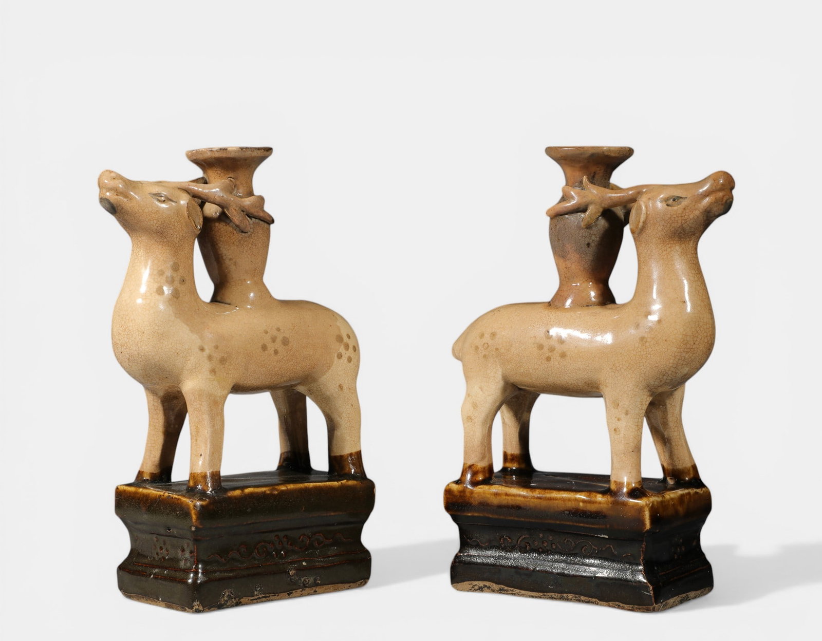 Pair of zoomorphic candlesticks held by deer (1 of 3)
