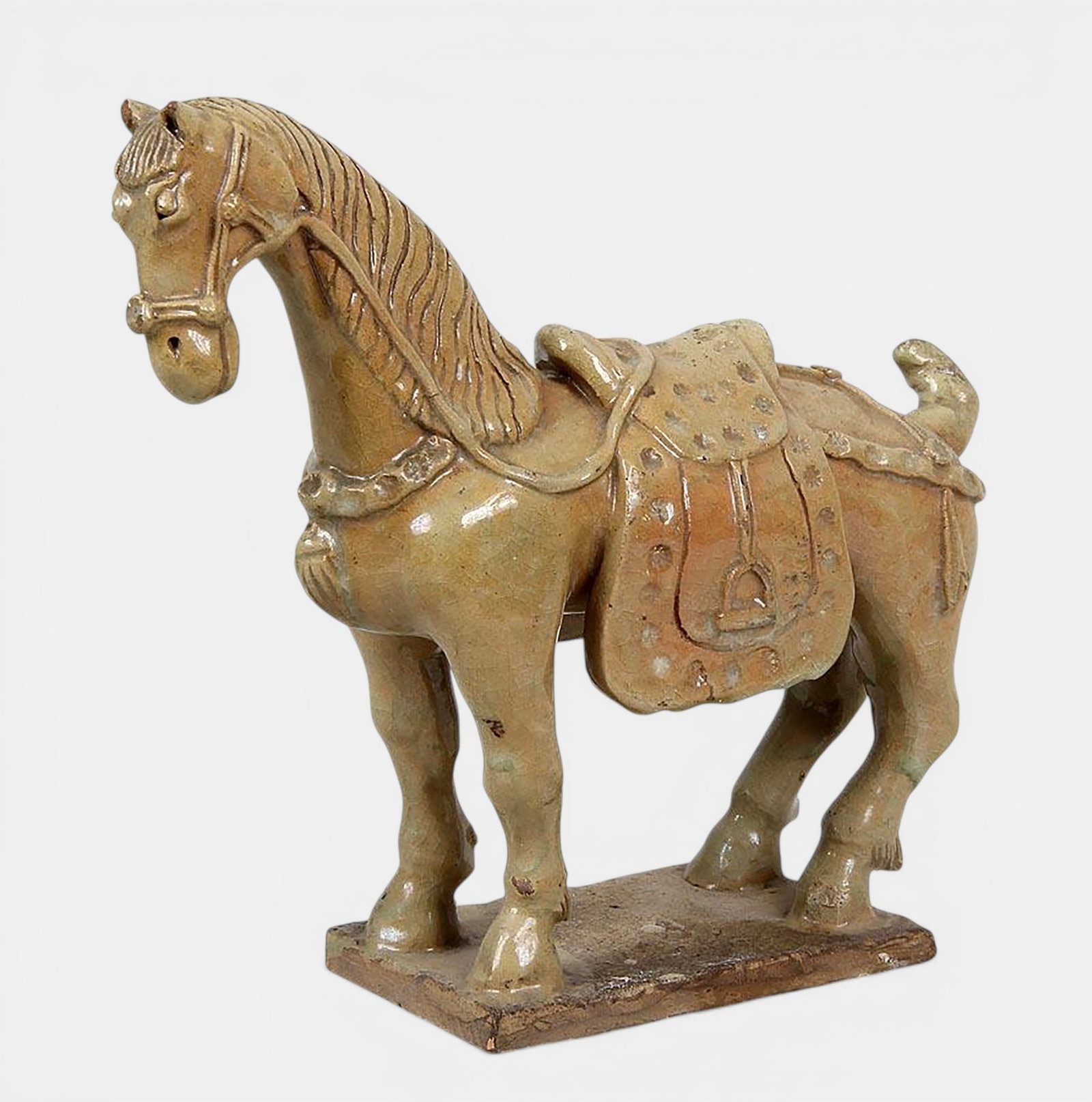 A harnessed Ming horse with all four legs resting on a terrace (1 of 4)