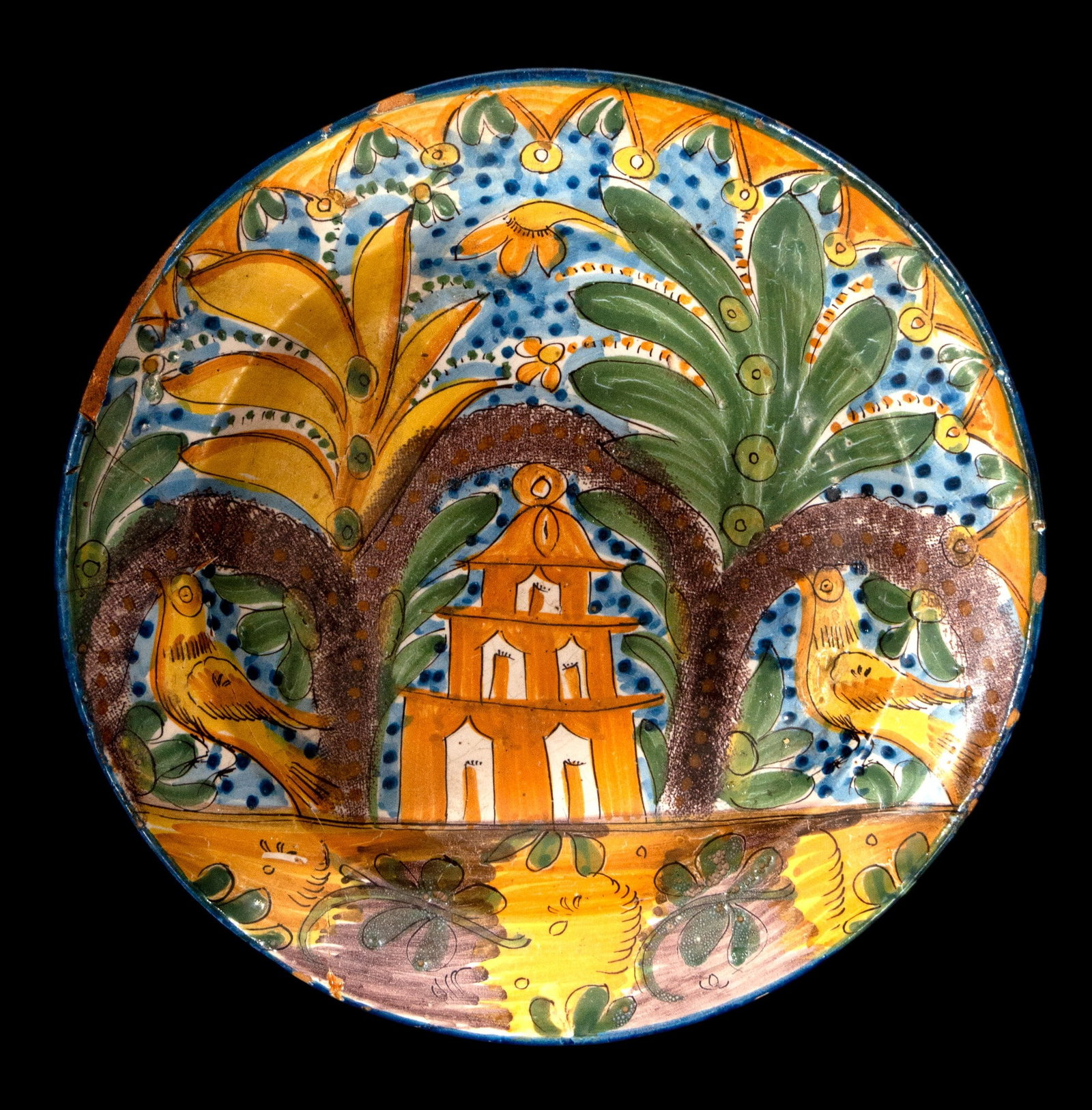 Ceramic plate by Ribas Alves. Spanish School. 19th century.: Glazed and polychrome ceramic. Dimensions: 30 x 30 x 3.5 cm. Plate decorated with plant, architectural, and bird motifs framed by a circular border, in vivid yellow, green, and blue tones. An example 