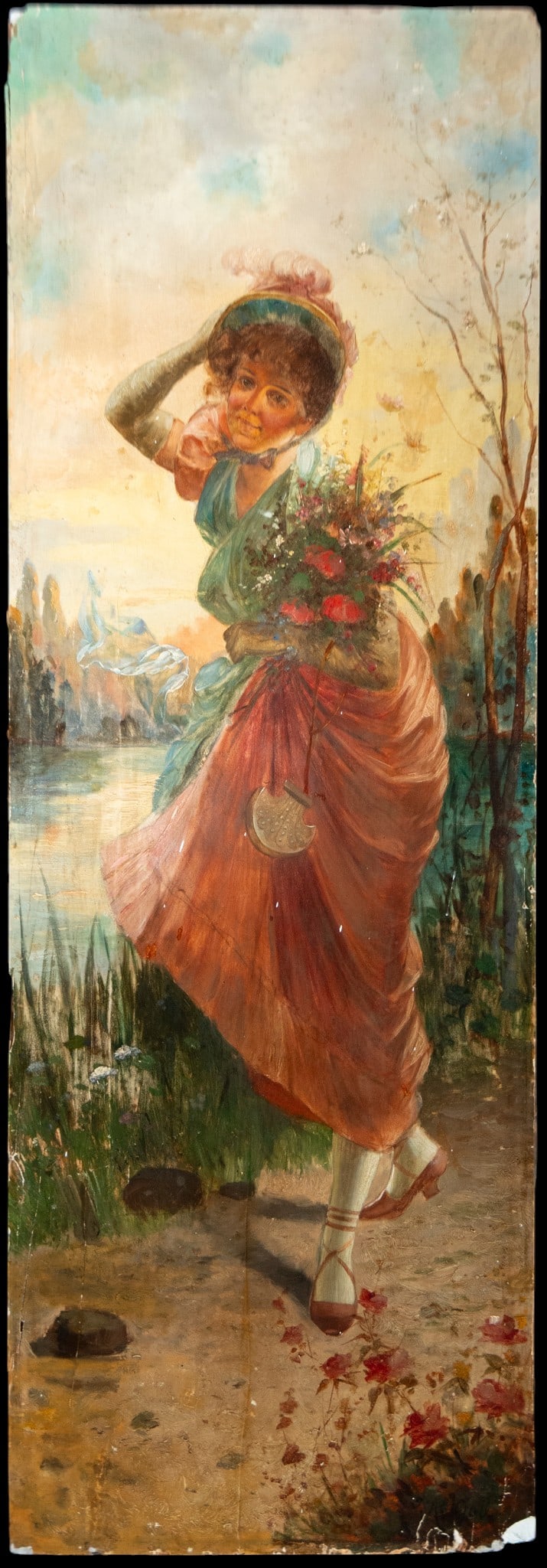 Young woman carrying flowers. Possibly French School. 19th century: Oil on panel. Dimensions 100 x 30 cm. This elongated composition features a young woman carrying a basket overflowing with flowers as she walks past a lakeside landscape bathed in luminous light. The 