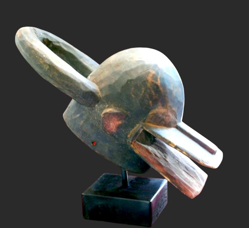 Large Chamba Zoomorphic Mask with Stand: Wood. Large zoomorphic Chamba helmet mask, from Nigeria and Cameroon, with a display stand. Nam Gbalang mask, identified as a wild creature, with prominent horns and jaws. Made of dense wood with deta