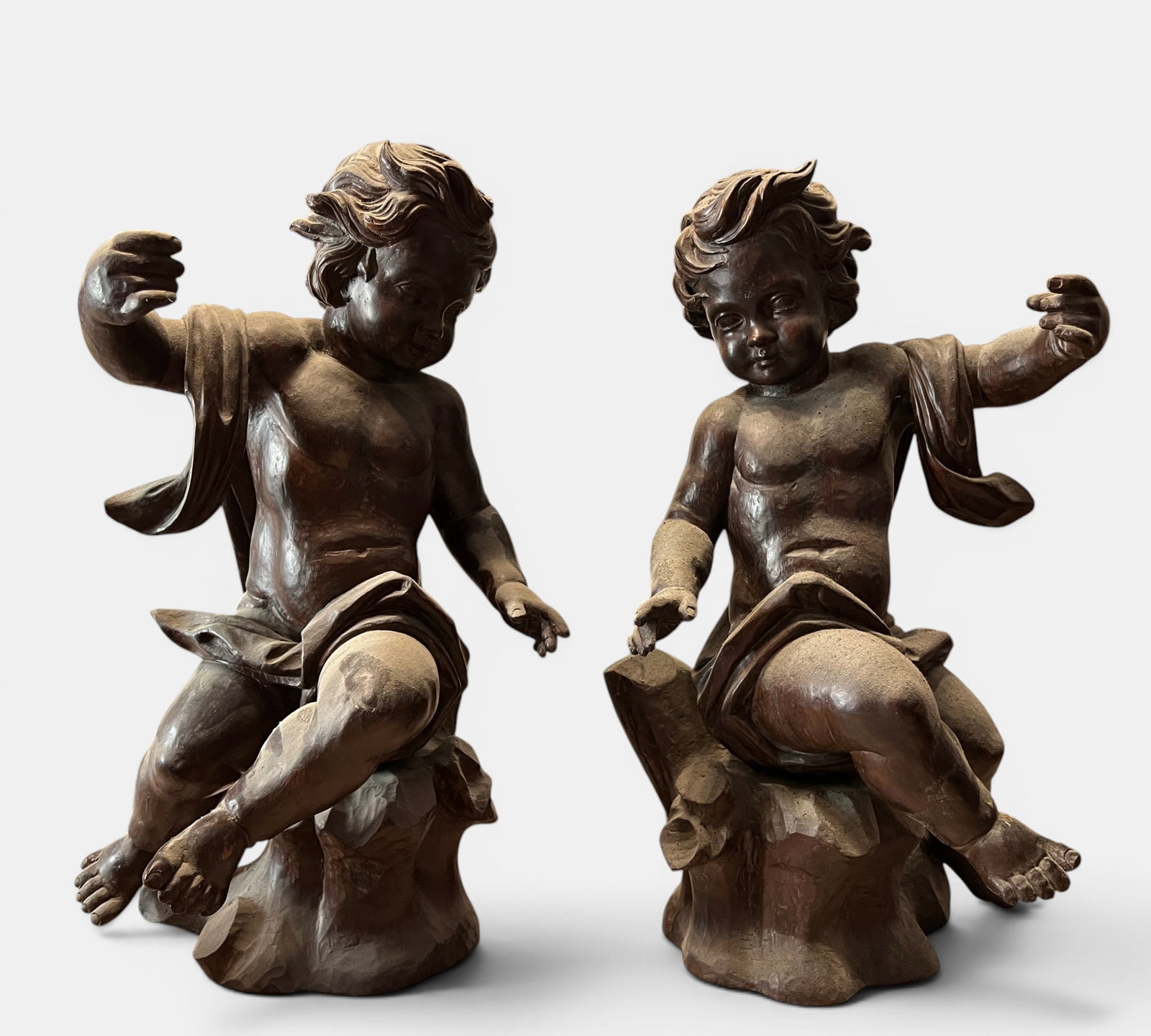 Important Large Pair of Sculptures of Seated Angels, France, early 20th century: Measurements of each: 60 x 38 cm